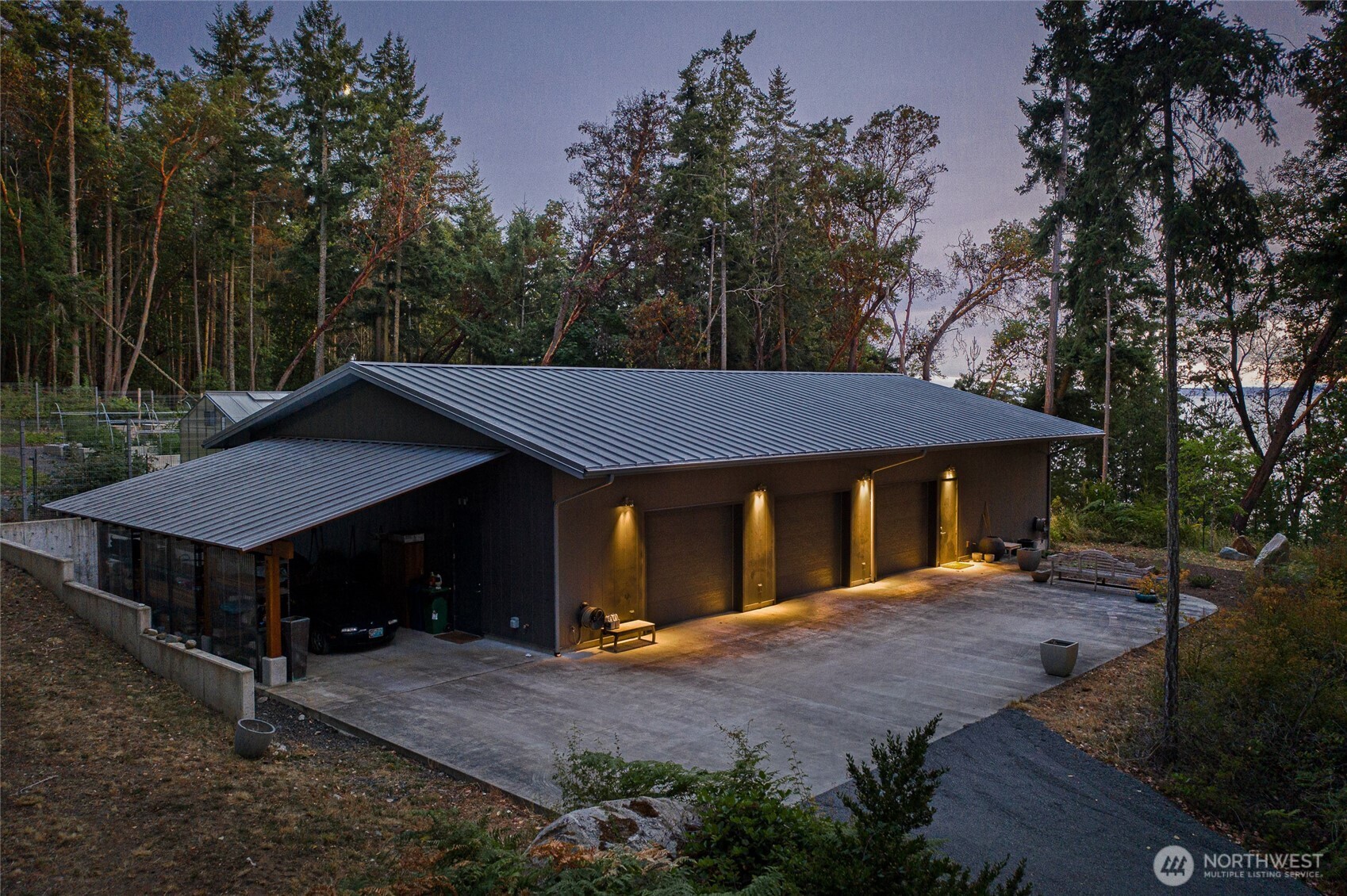 Expansive detached workshop and multi-bay garage provide exceptional space for vehicles, equipment, and creative projects—an ideal complement to this luxury San Juan Island estate.