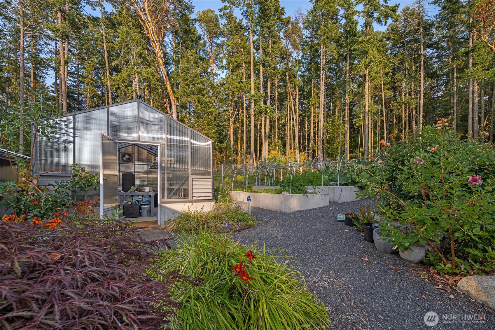 A fully equipped greenhouse and productive garden space allow for year-round growing, complementing the estate’s self-sufficient island lifestyle on San Juan Island’s coveted west side.