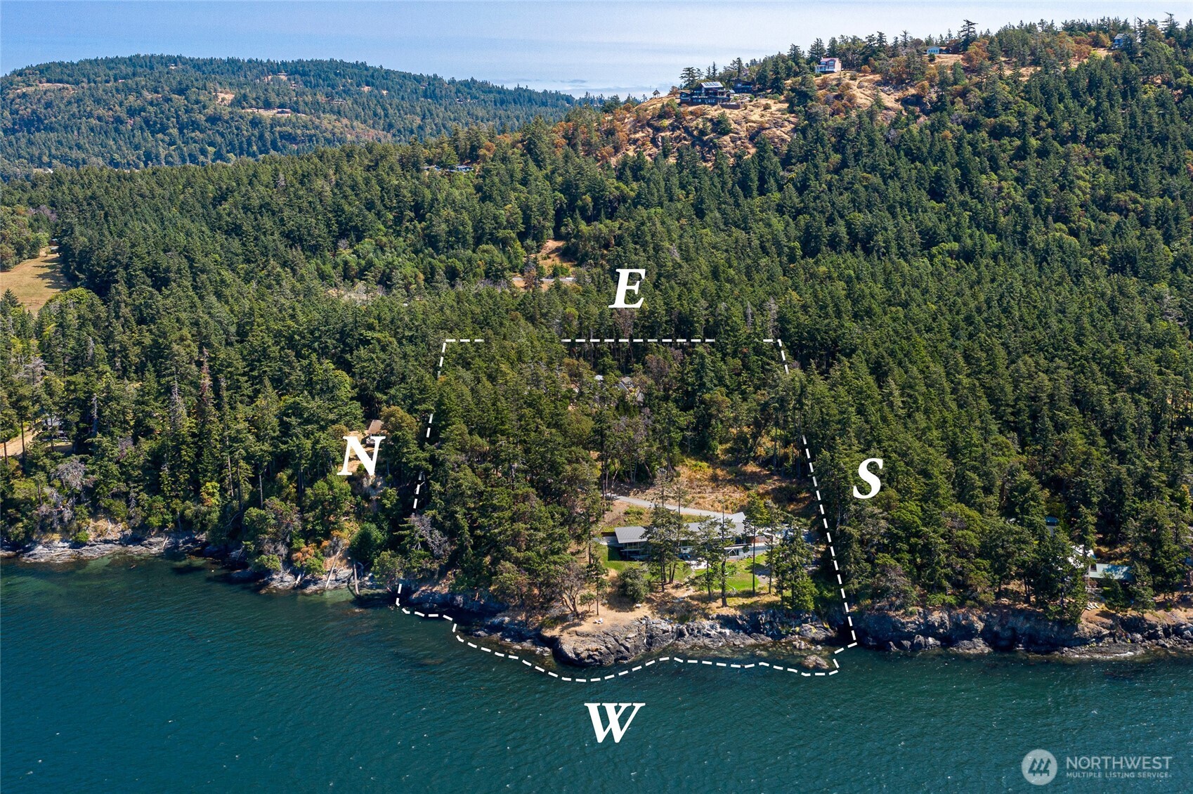 Private west side San Juan Island waterfront estate set on 6± acres with 400± feet of shoreline along Haro Strait. Clearly defined boundaries showcase the rare combination of privacy, forested acreage, and expansive west-facing waterfront.