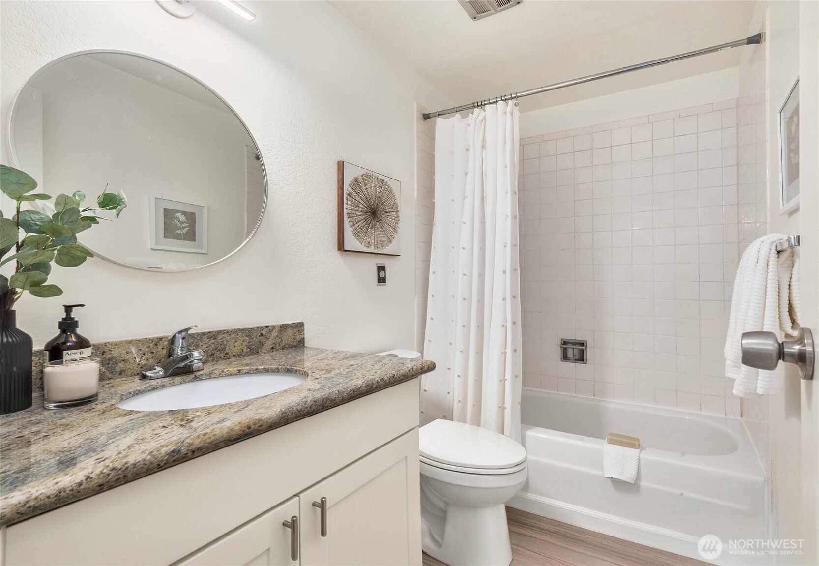 Second bathroom with granite countertop.