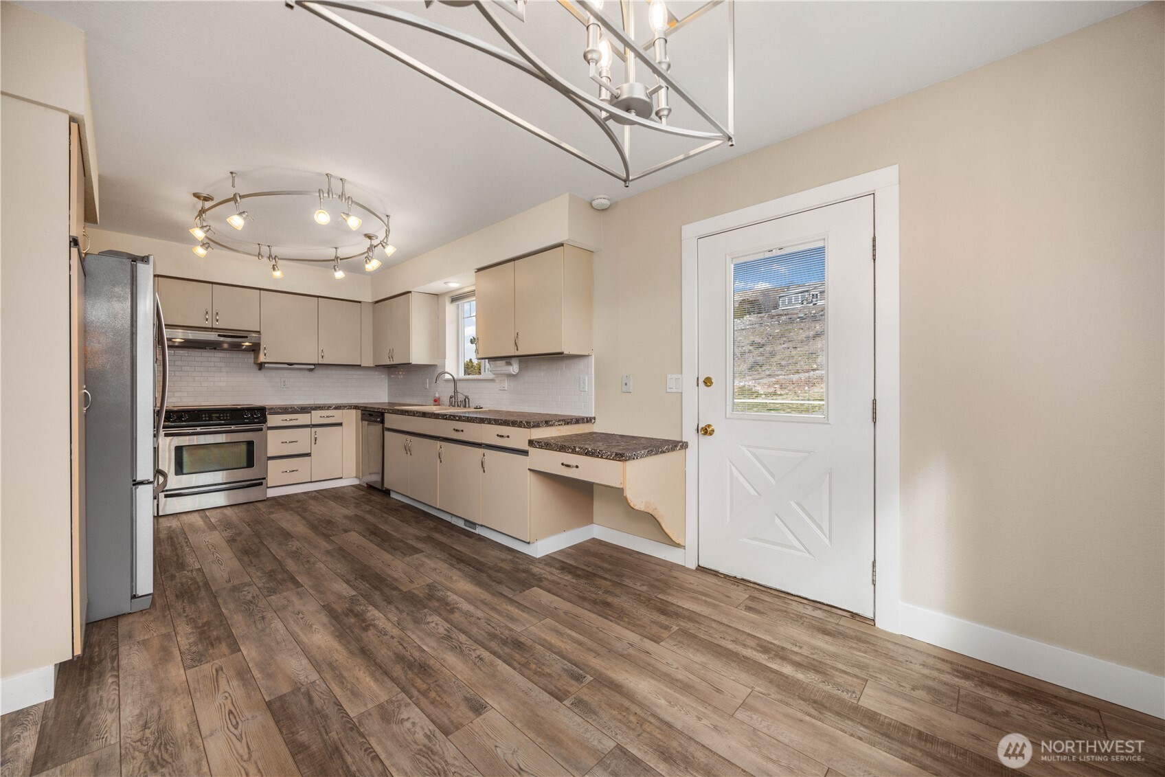 Kitchen, Dining & Door to Deck.