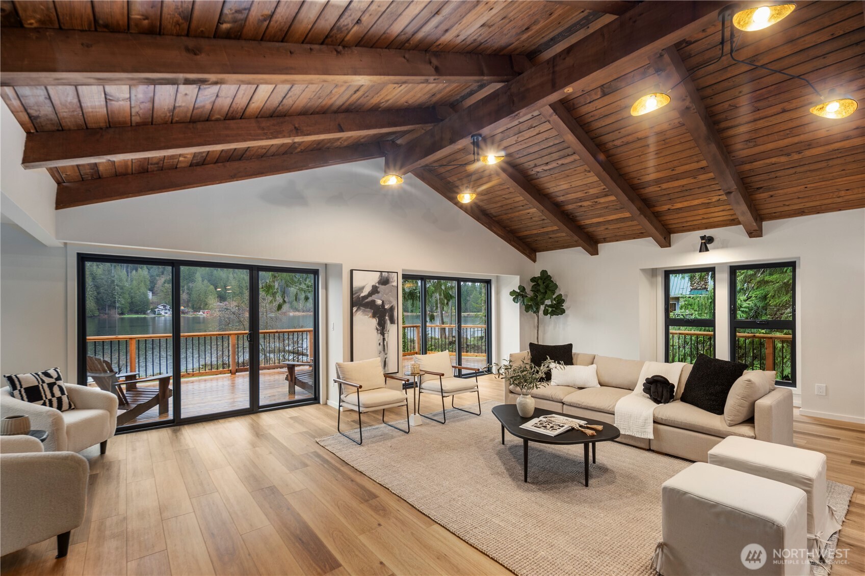 Stunning living room with wall to wall lake views