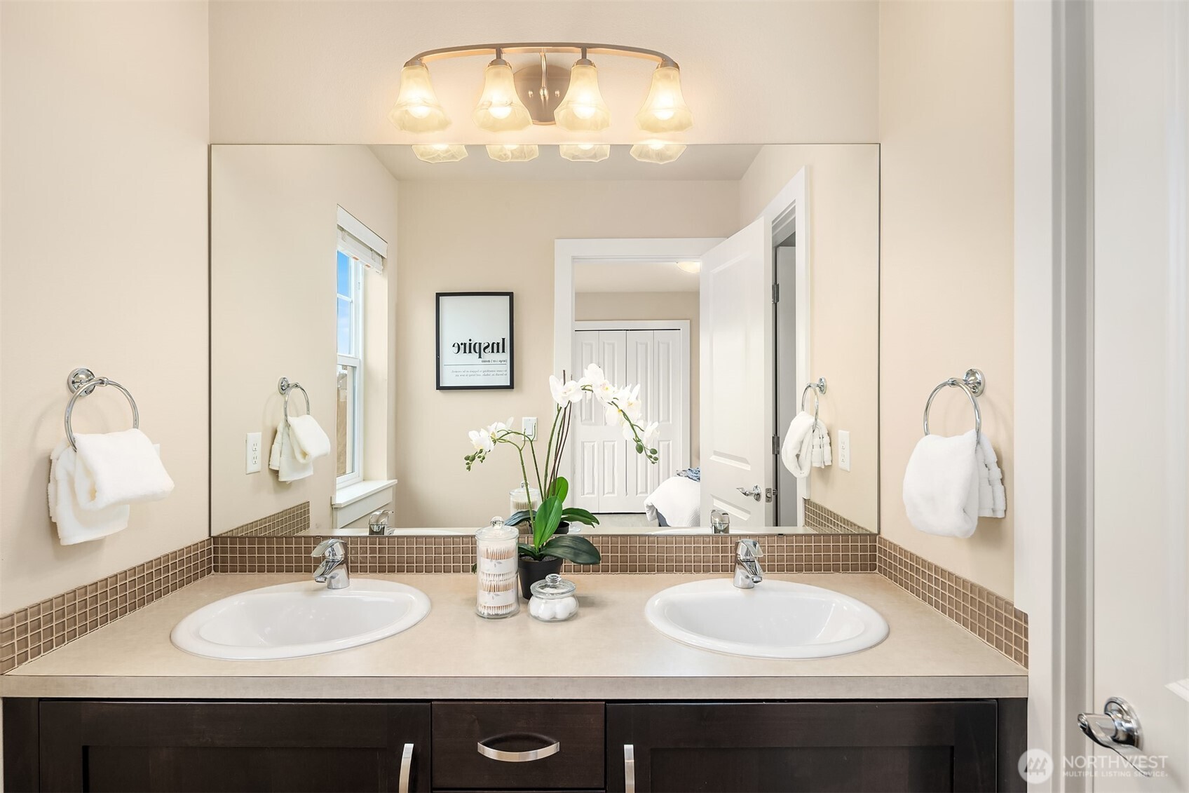 Dual vanities in the guest bathroom, with a door connecting to the shower/tub and toilet - optimizing privacy!