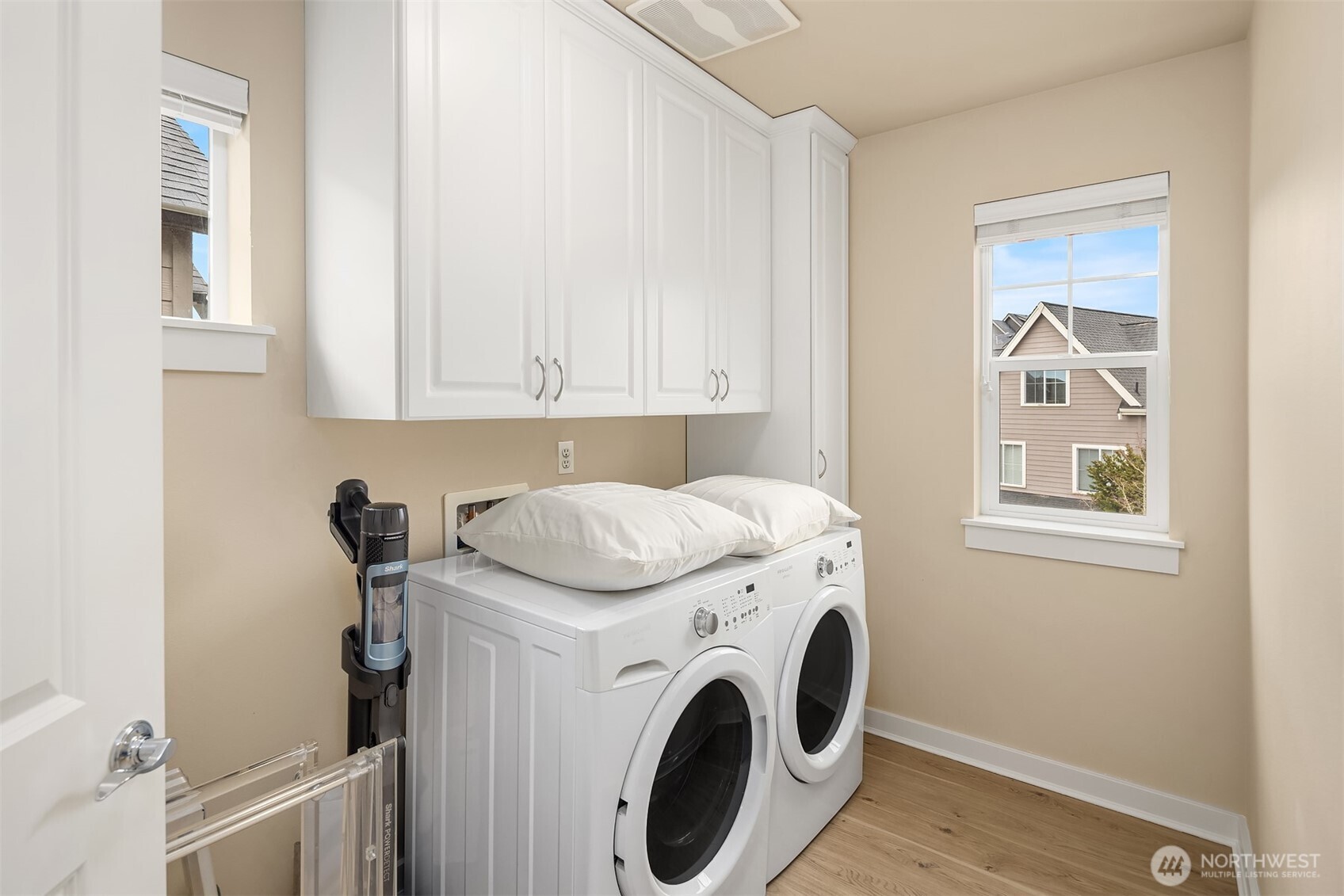 Large laundry room with additional storage space and plenty of room for full size side by side washer and dryer. This is a rare find in West Highland Park homes, where many other homes only have a laundry closet and / or stackable machines.