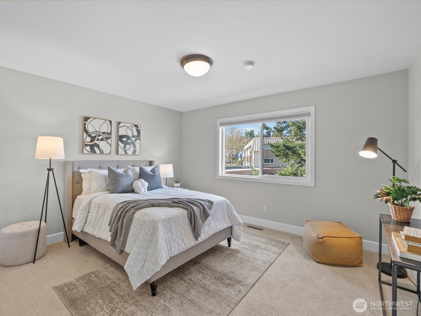 Bedroom with window, natural light, and carpet flooring