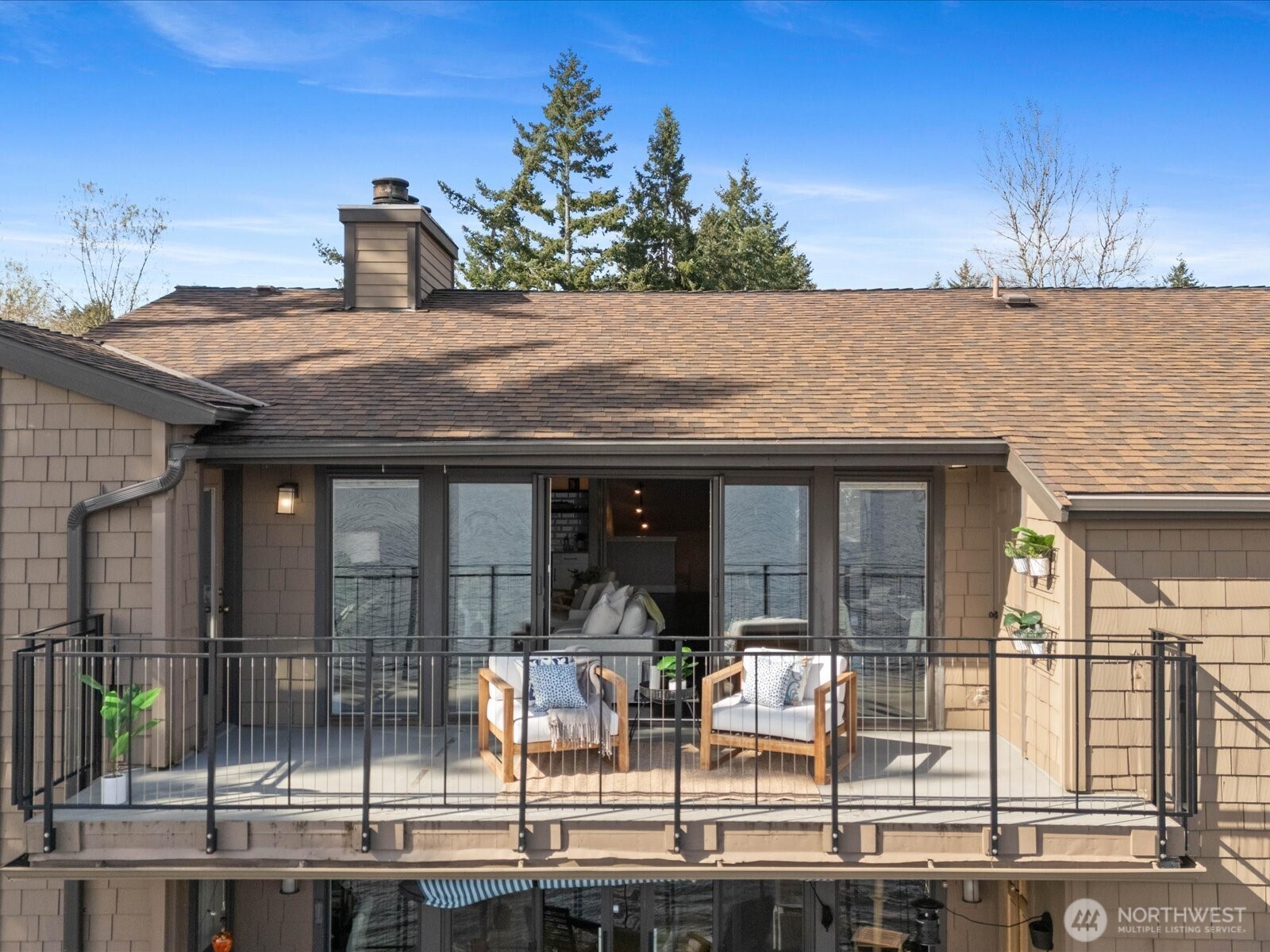 Exterior view of building with private deck and Lake Sammamish waterfront setting