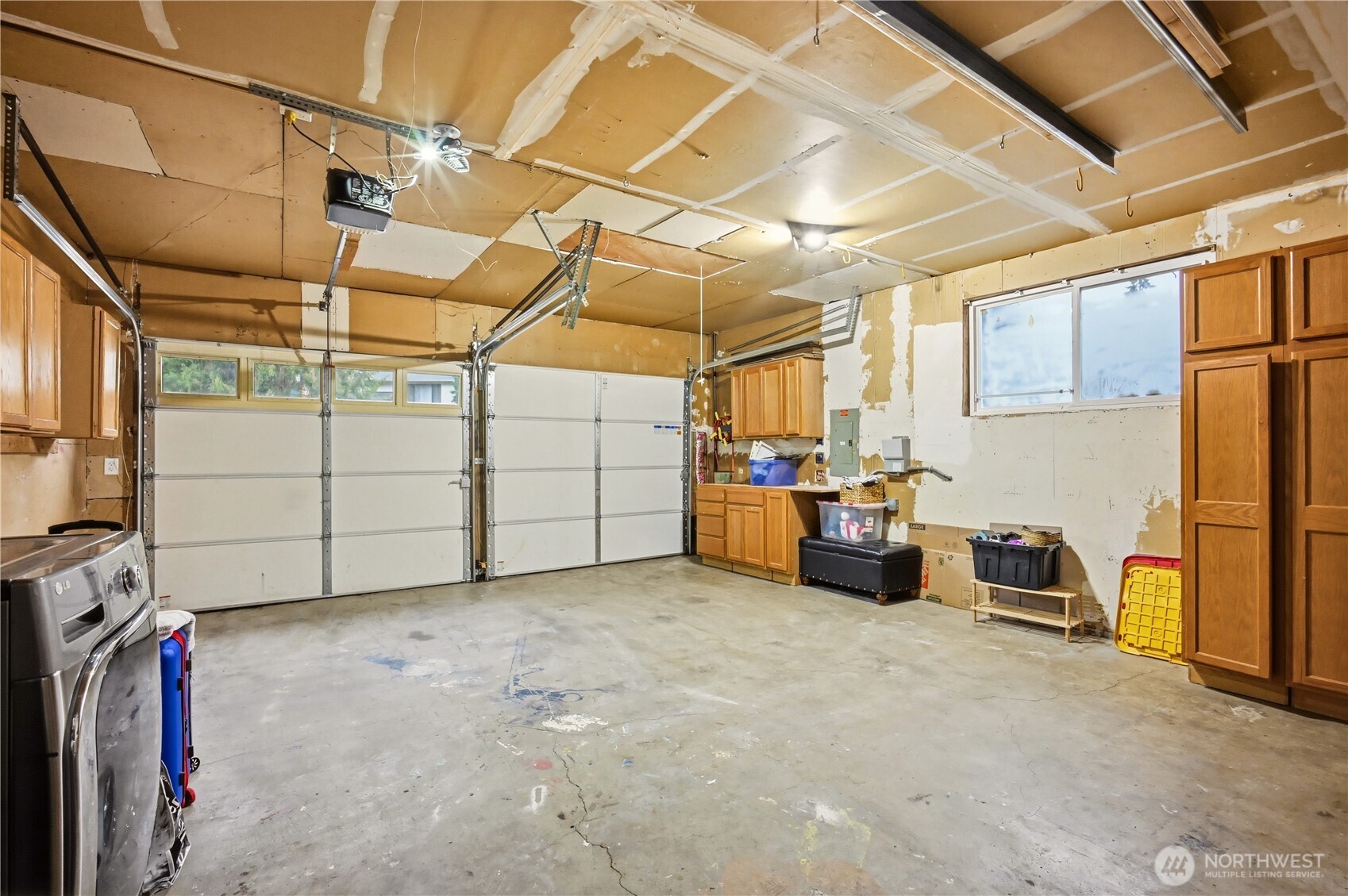 Convenient attached garage with built-in storage and workshop space to keep your gear organized.