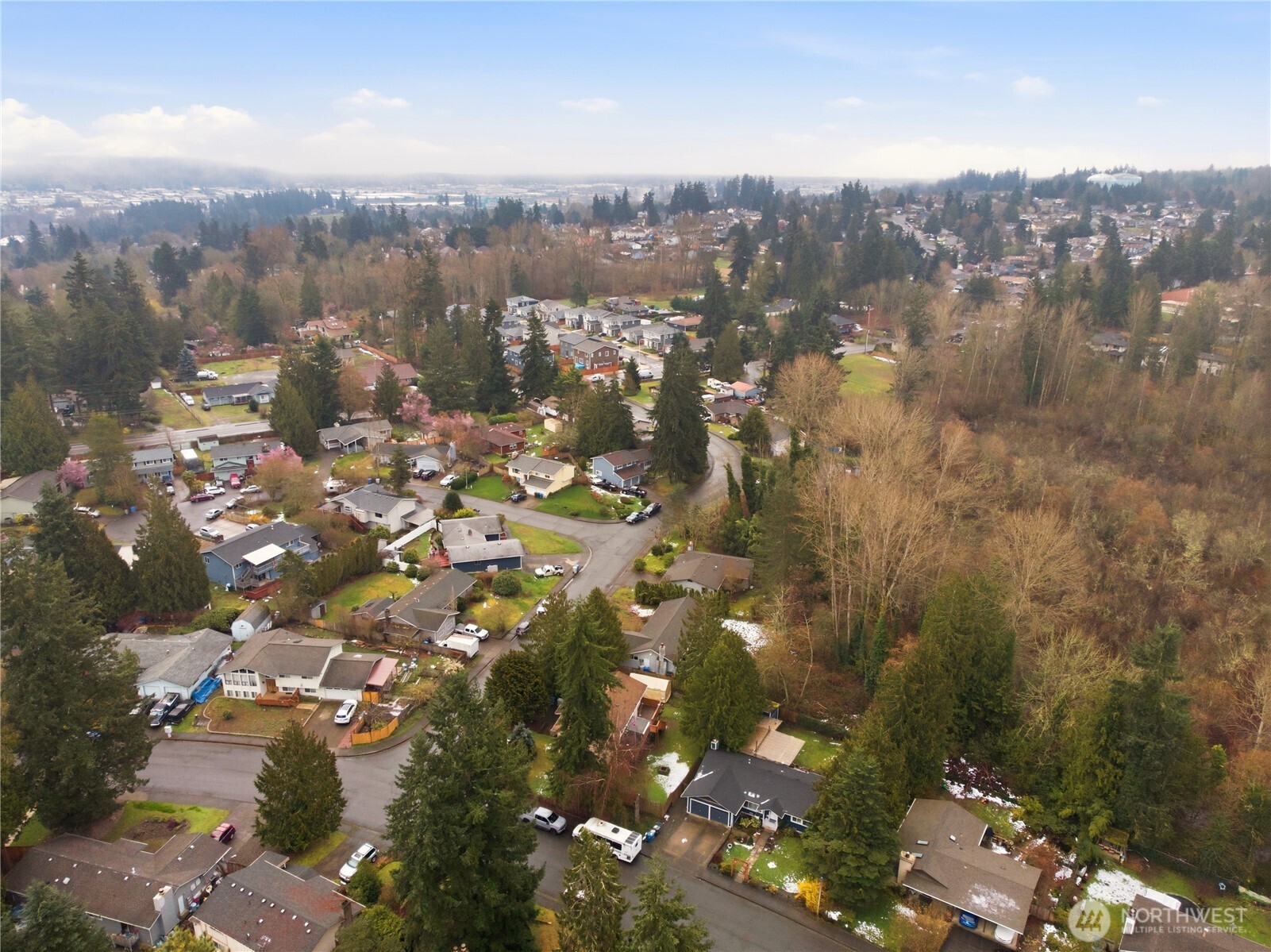 Bird's-eye perspective of the home's footprint and quiet neighborhood setting.