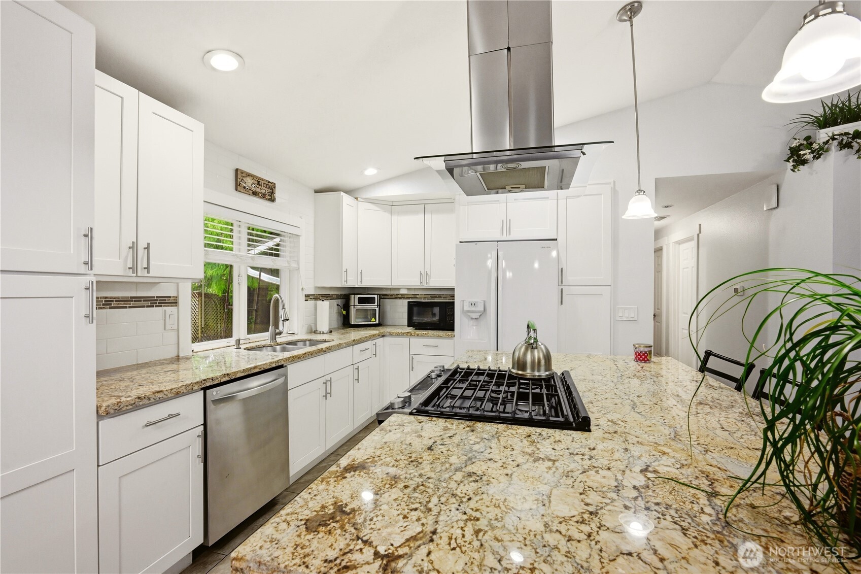 This kitchen has been tastefully remodeled featuring elegant surfaces.