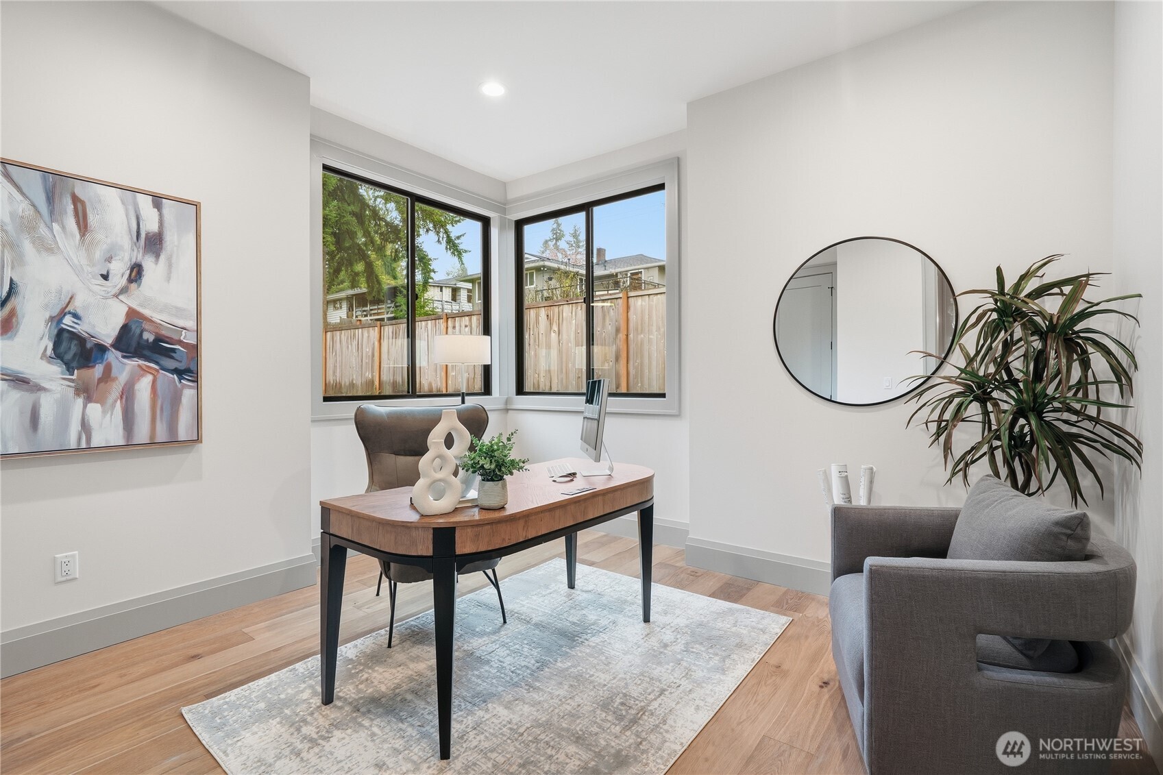 Enjoy a covered, heated patio designed for year-round comfort, with the ability to fully open for a seamless transition between indoor and outdoor entertaining. The exterior space is thoughtfully appointed with an outdoor fireplace, built-in BBQ, and refrigerator, all overlooking a rare, flat, and fully usable backyard.