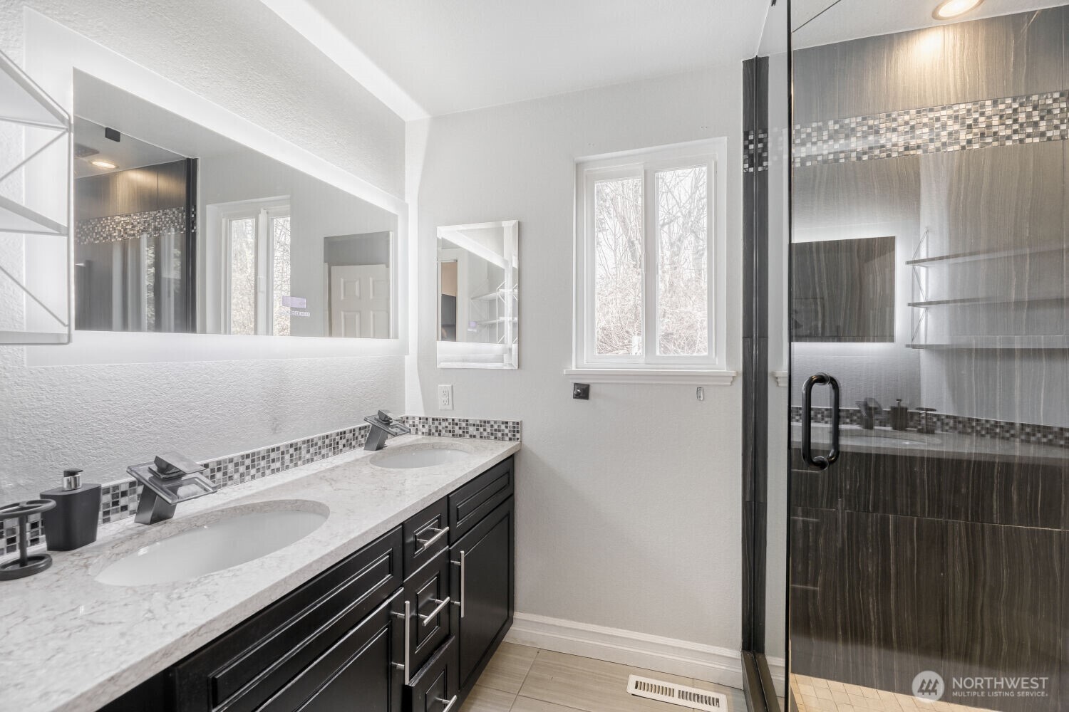 Main floor prime 3/4 bath. Totally updated with recess lighting in the mirror. Large rain shower head and side shower heads.