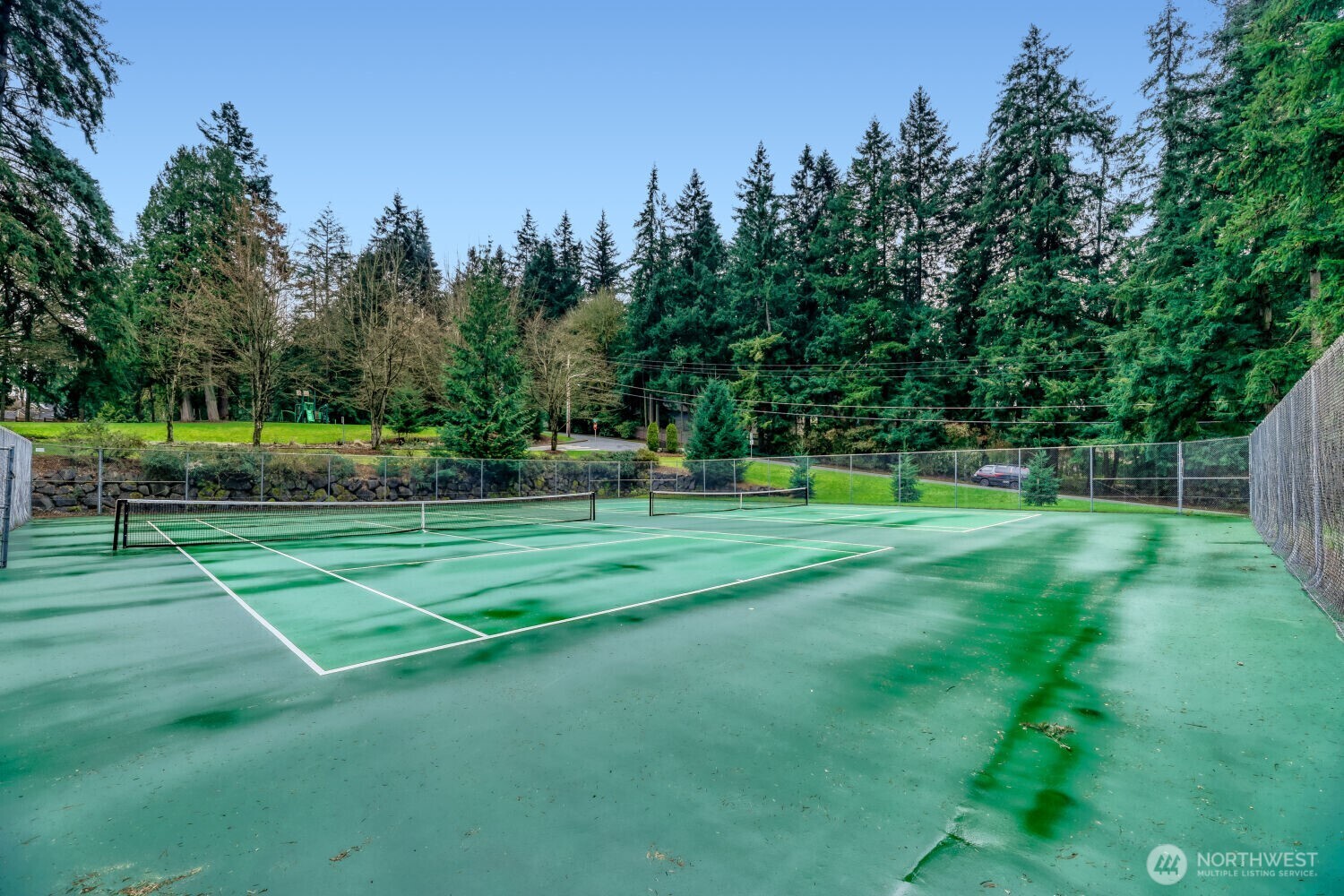 At the entrance of the neighborhood is tennis/pickel ball courts