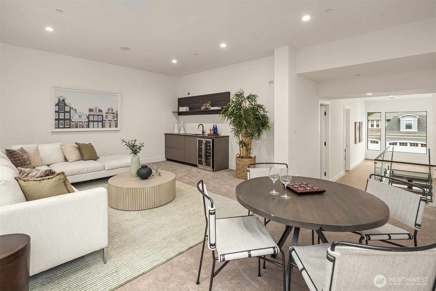 A loft or second living area located on the upper level is complete with a wet bar with a mini fridge/wine cooler and built-in speakers.