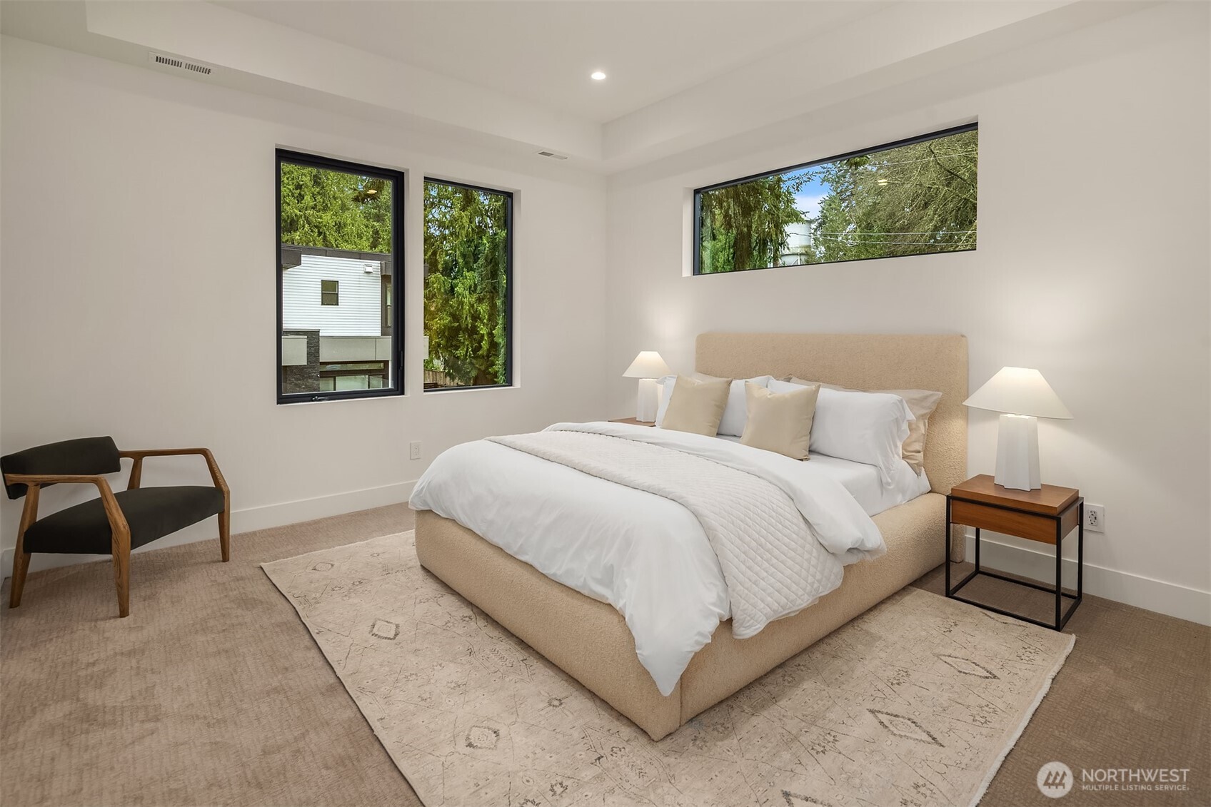 One of three ensuite bedrooms complete with high-end custom cabinetry in the closets.
