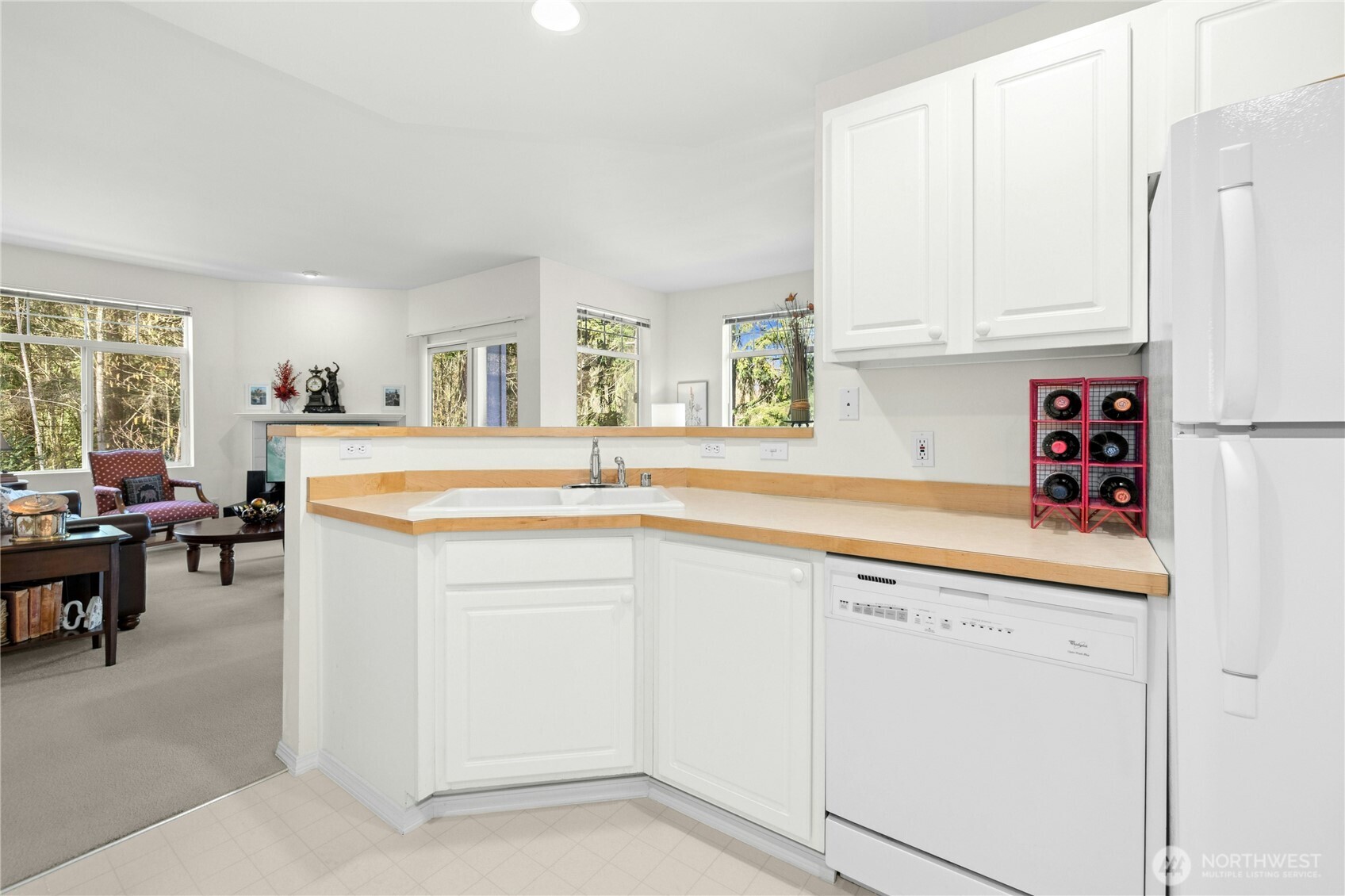 Open-concept kitchen flows effortlessly into dining and living areas