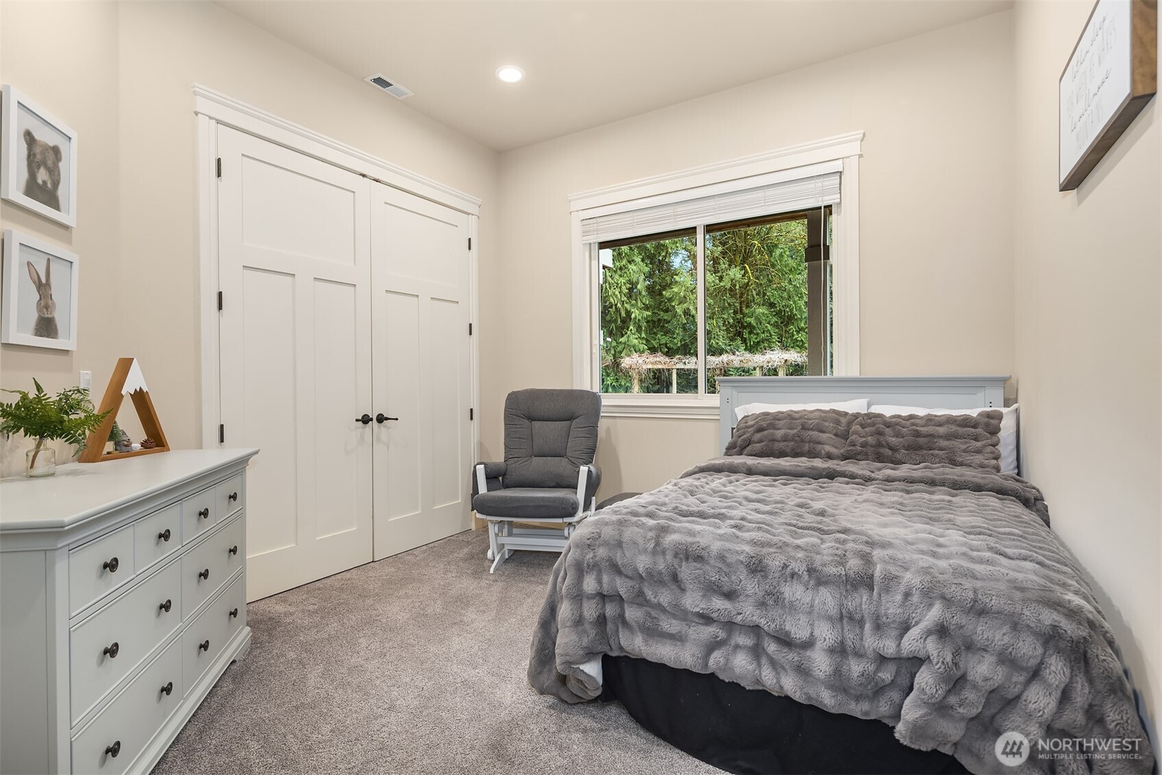 Bedroom 2 with 10 foot ceilings and large closet.