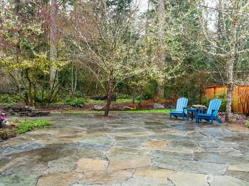 Expansive outdoor living area tastefully created with flag stones, in a random pattern creating an natural, earthy setting to enjoy the outdoors
