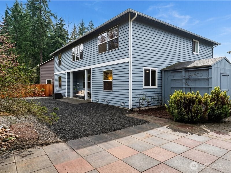 Large pavered area off back can double as outdoor entertaining area or a place for outdoor recreation
