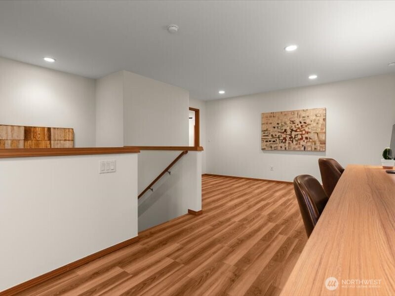 Beautiful wood-like Luxury vinyl flooring continues form lower level, upstairs and throughout upstairs hallways and primary bedroom