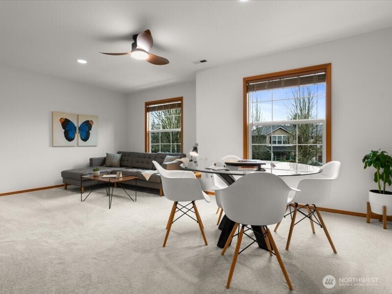 Versatile upstairs bonus room with walk-in closet, can serve as a fifth bedroom, or provides ample space for movie nights or playing board games