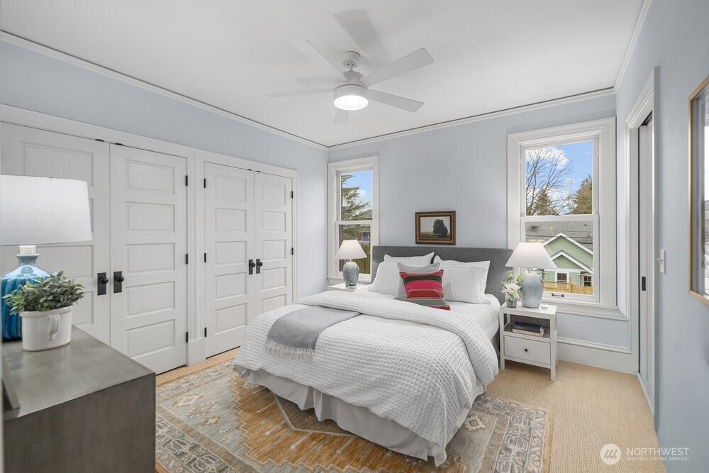 Primary bedroom with a wall of closets