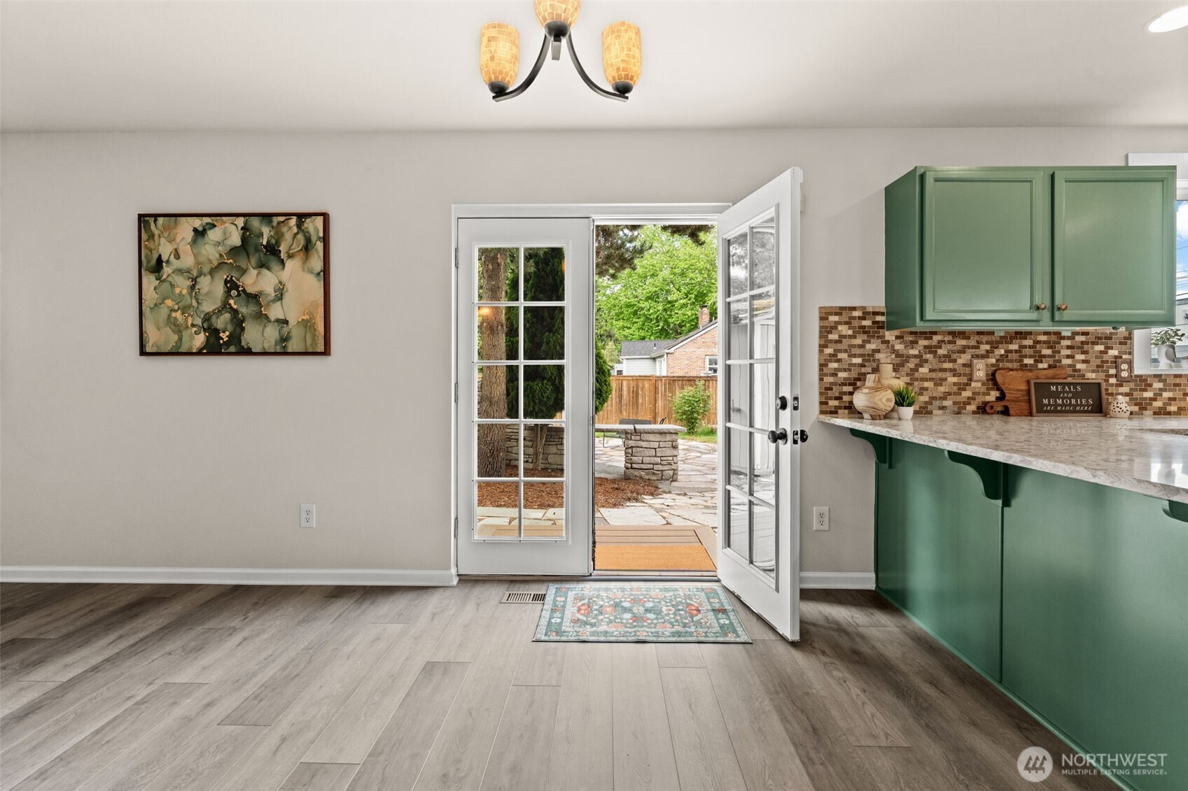 French doors lead to fenced backyard