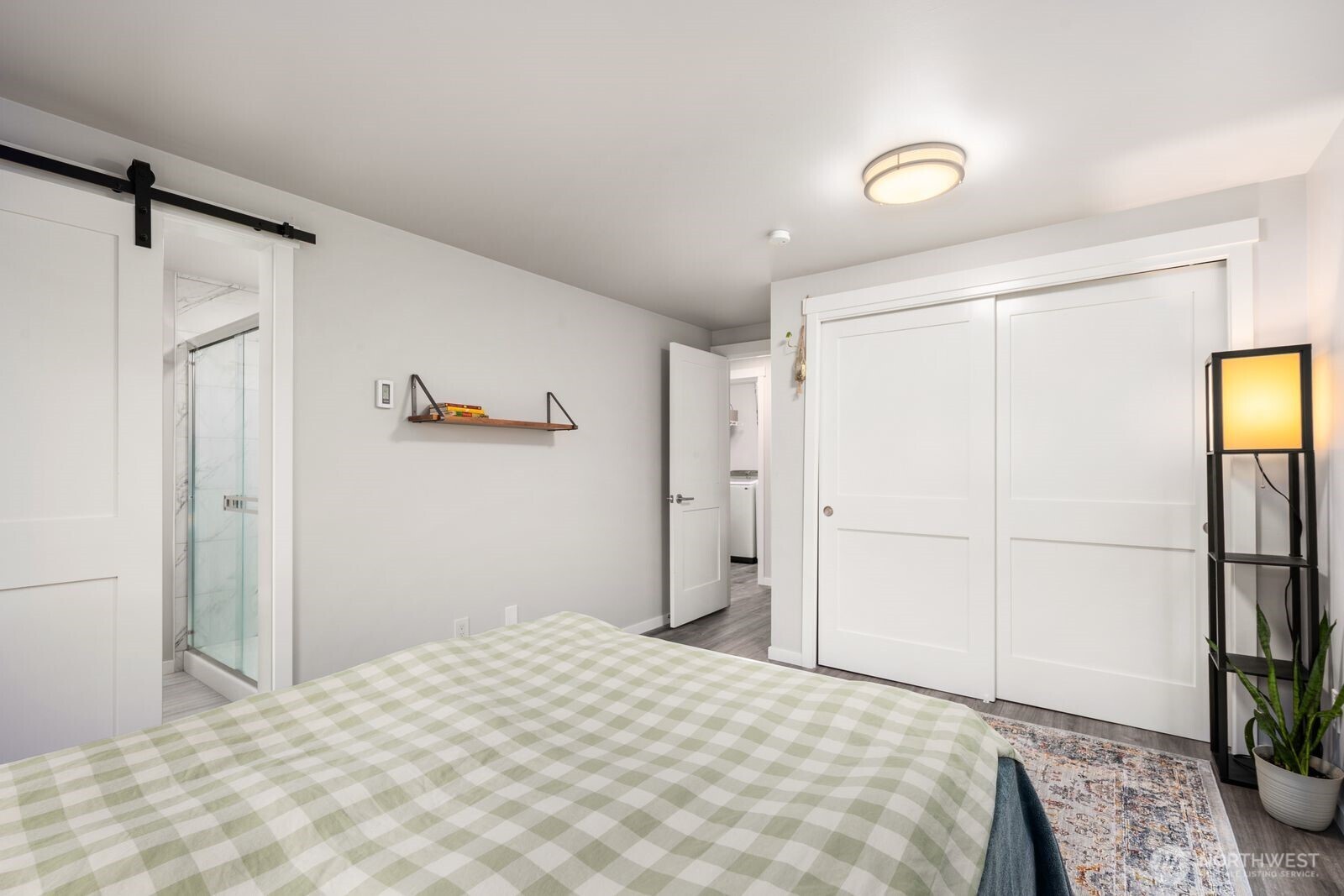 Primary bedroom with sliding door to bathroom