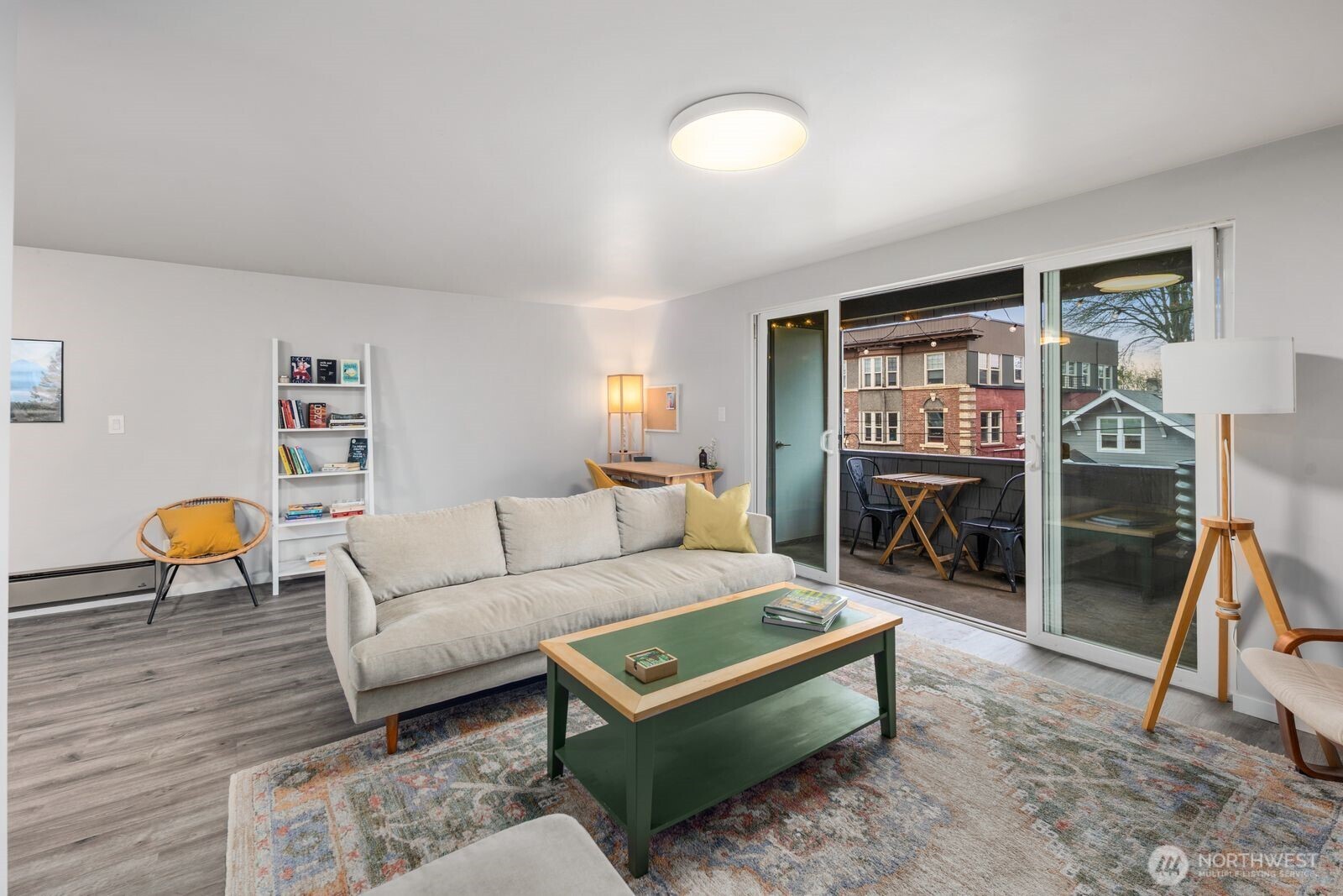 Living room with sliding door access to large deck