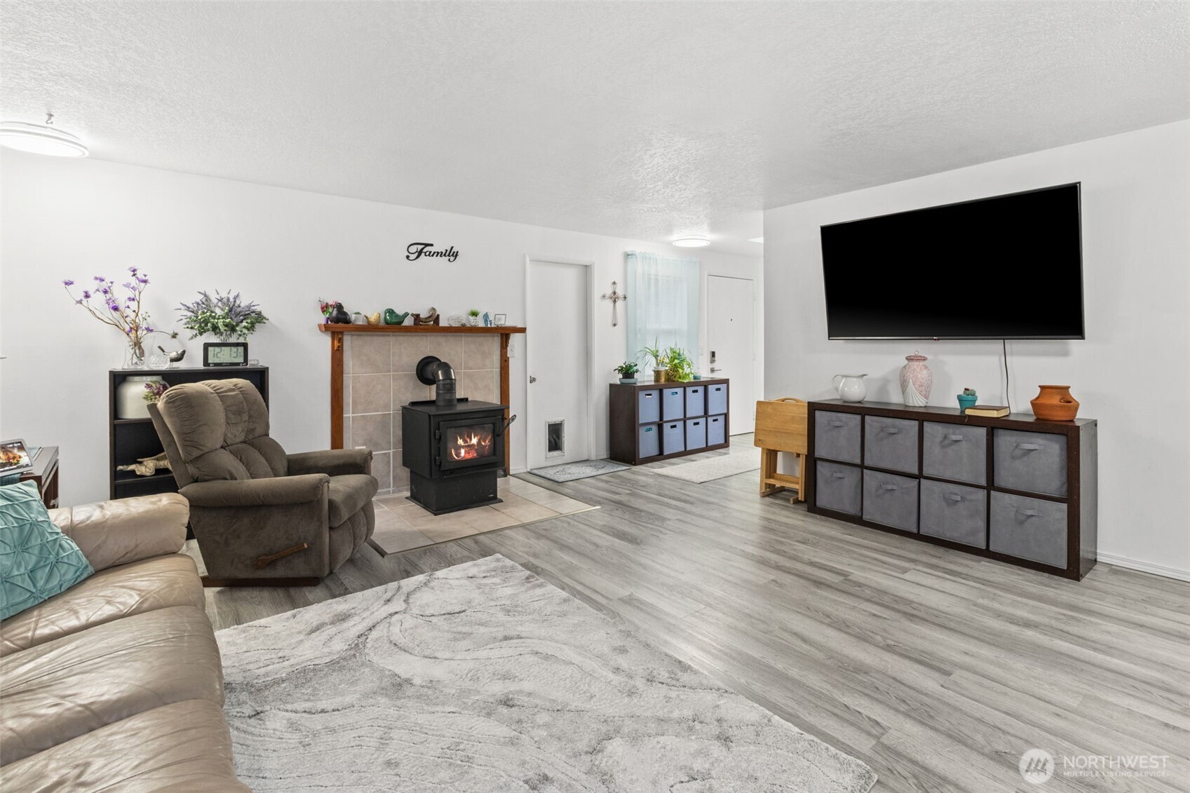 Spacious living room with wood burning stove