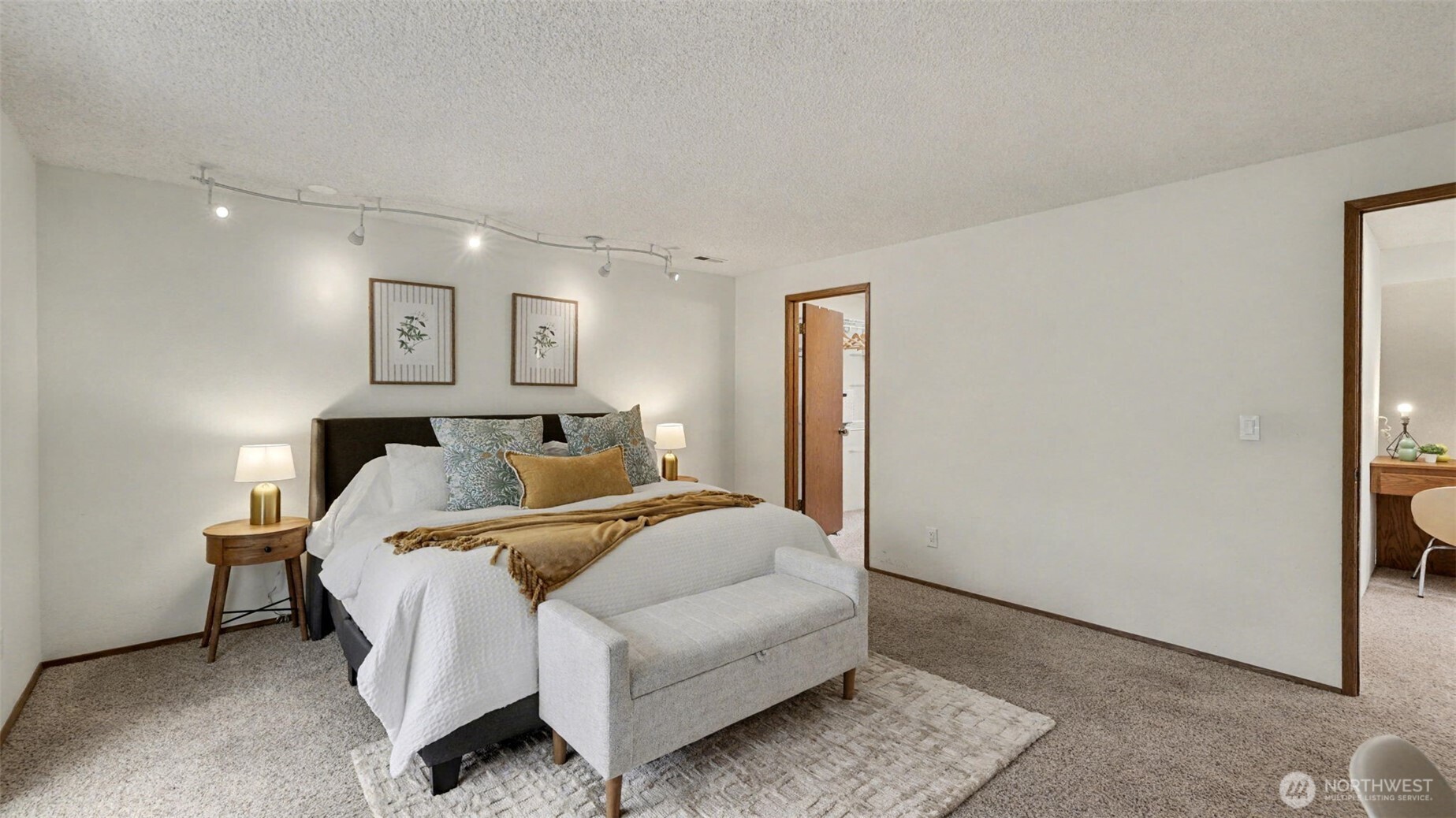 Designed for comfort and flexibility, this primary suite offers ample space for both rest and relaxation.