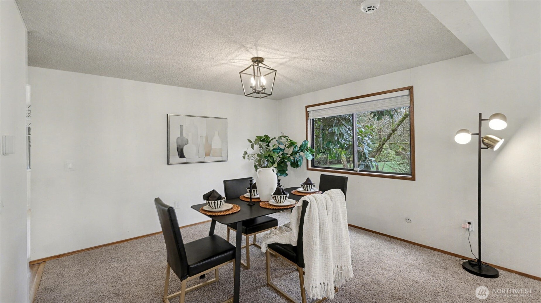 Bright and welcoming, this dining area offers the perfect setting to gather, dine, and unwind.