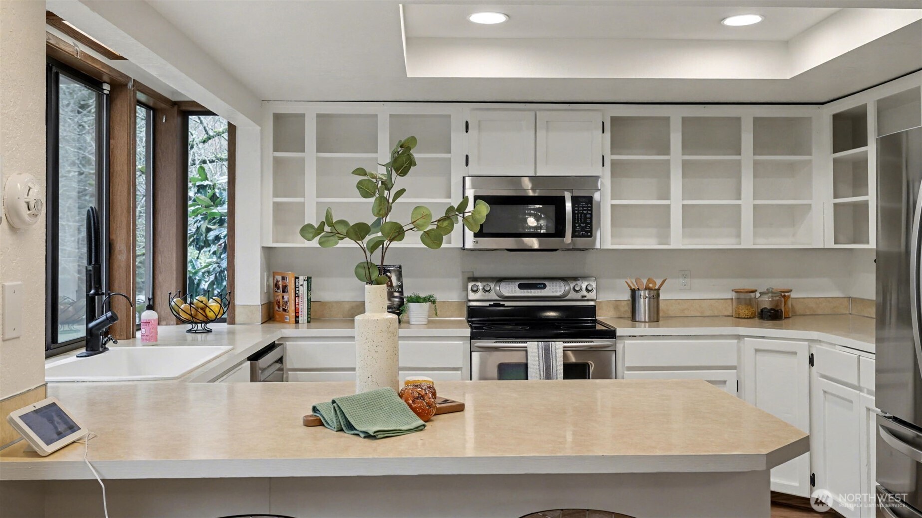 This well-appointed kitchen offers abundant cabinetry and a layout designed for easy meal prep and entertaining.
