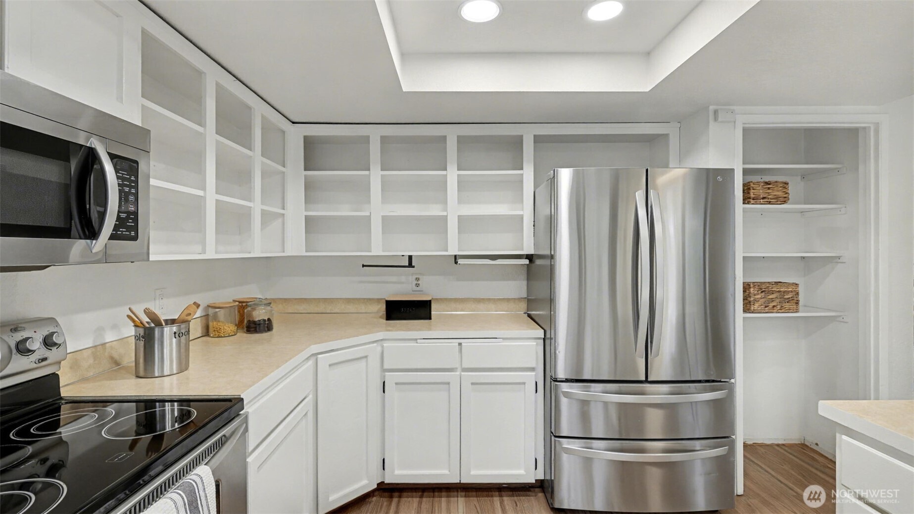 A spacious layout with abundant storage options, including open shelving for easy access and display.