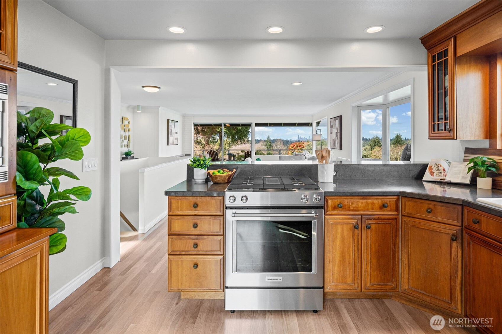 Cook with ease on the gas range while staying connected to the living spaces and outdoor views. Expansive countertops and thoughtful layout make everyday living and entertaining effortless.