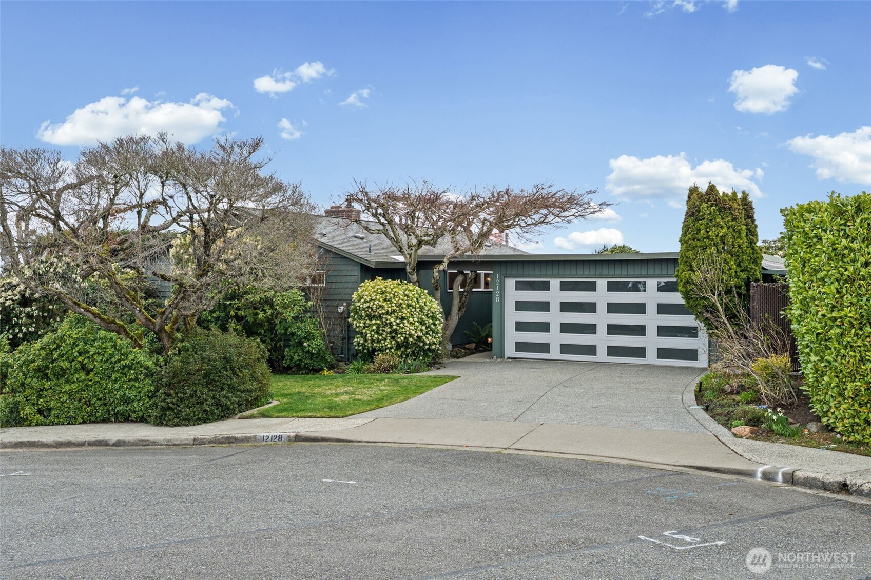 Beautifully updated Bellevue home with striking curb appeal, featuring modern exterior upgrades, lush mature landscaping, and an exposed aggregate driveway. Ideally located in a sought-after Bellevue neighborhood, this home blends timeless design with contemporary enhancements.