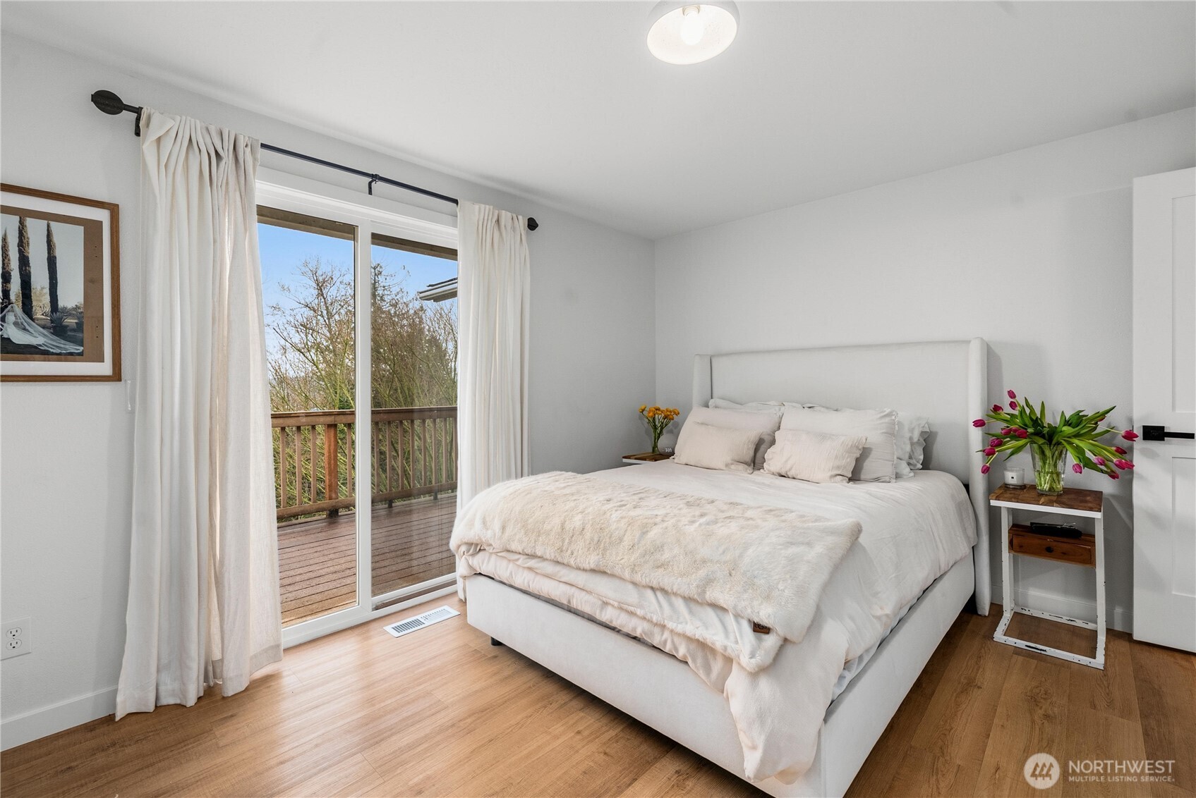The full bath also got new wide plank LVP and fresh paint to set off the solid oak cabinetry.
