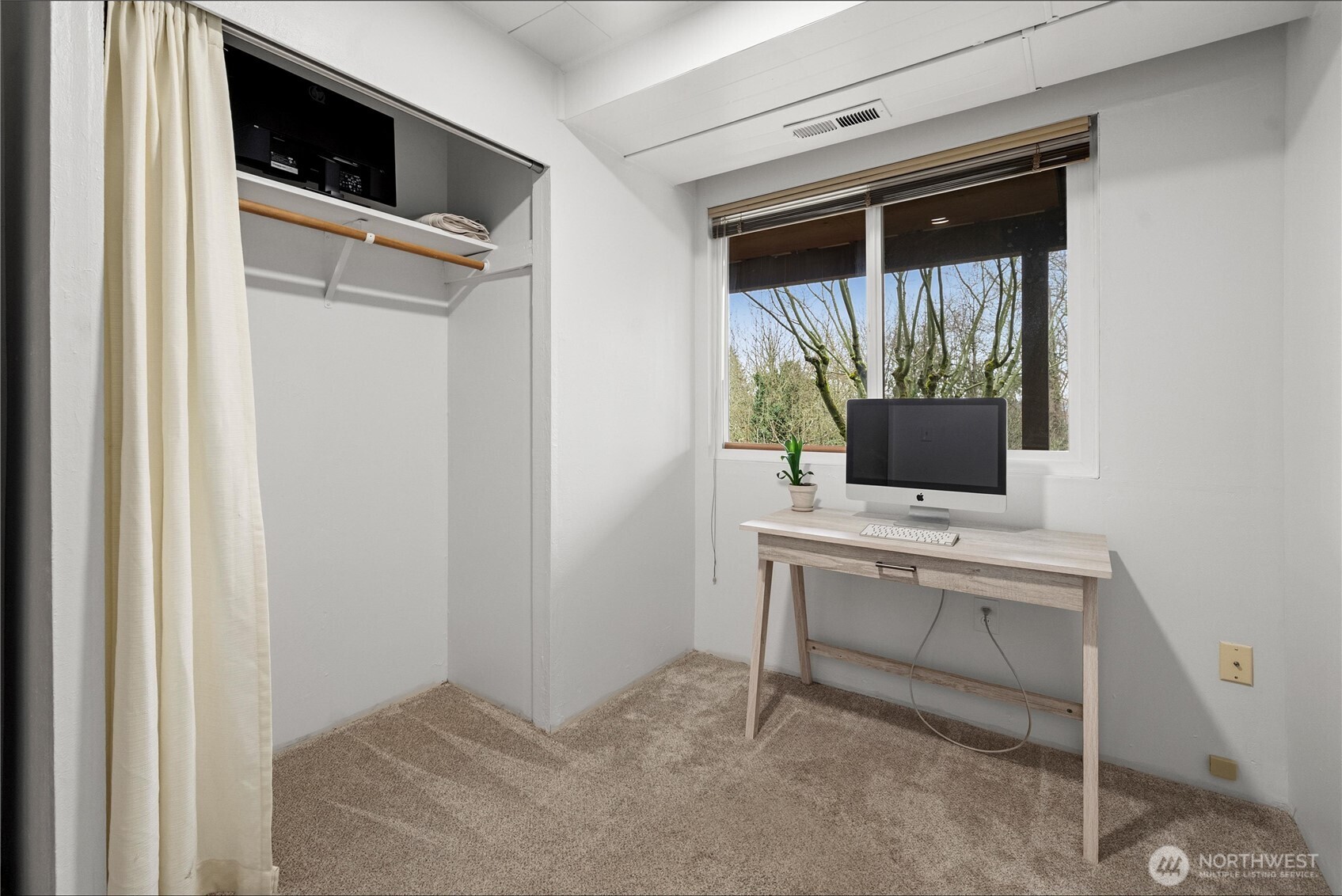 The downstairs studio has a private door to the back yard. Perfect space for a shop, home gym, art studio or crafting space.