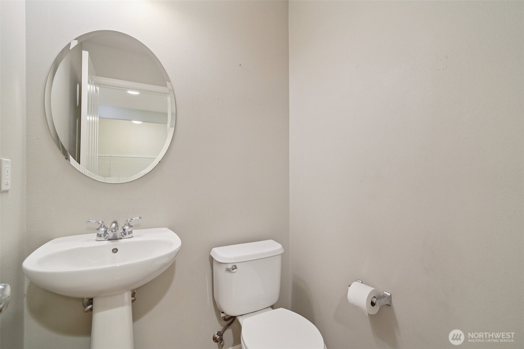 Powder room next to garage