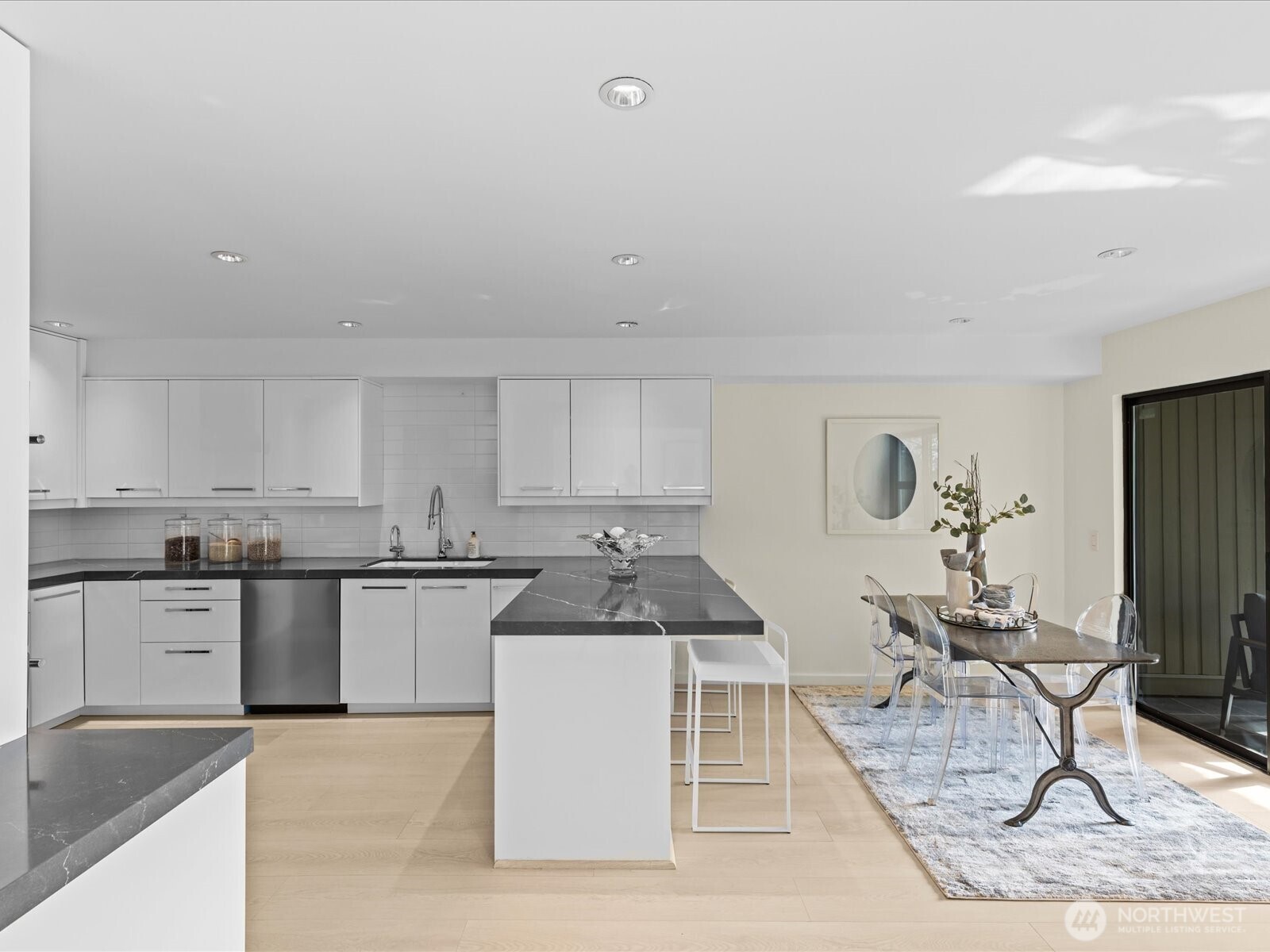 Chef’s kitchen with a versatile breakfast nook, perfect for casual dining or a cozy den to watch TV or read.