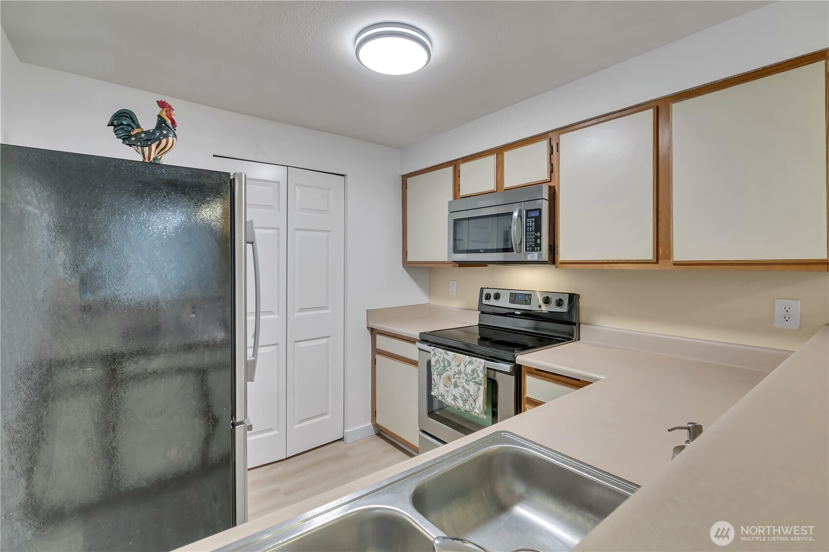 In-unit washer and dryer behind the folding doors in the center