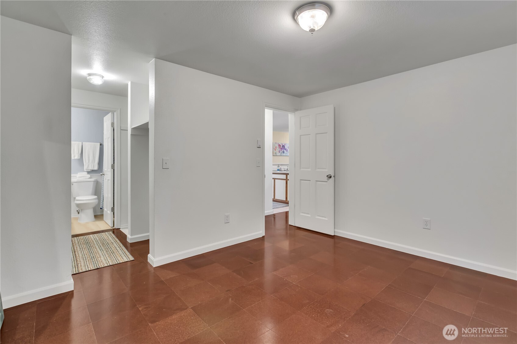 Primary bedroom with pass-through closet on the way to attached bath