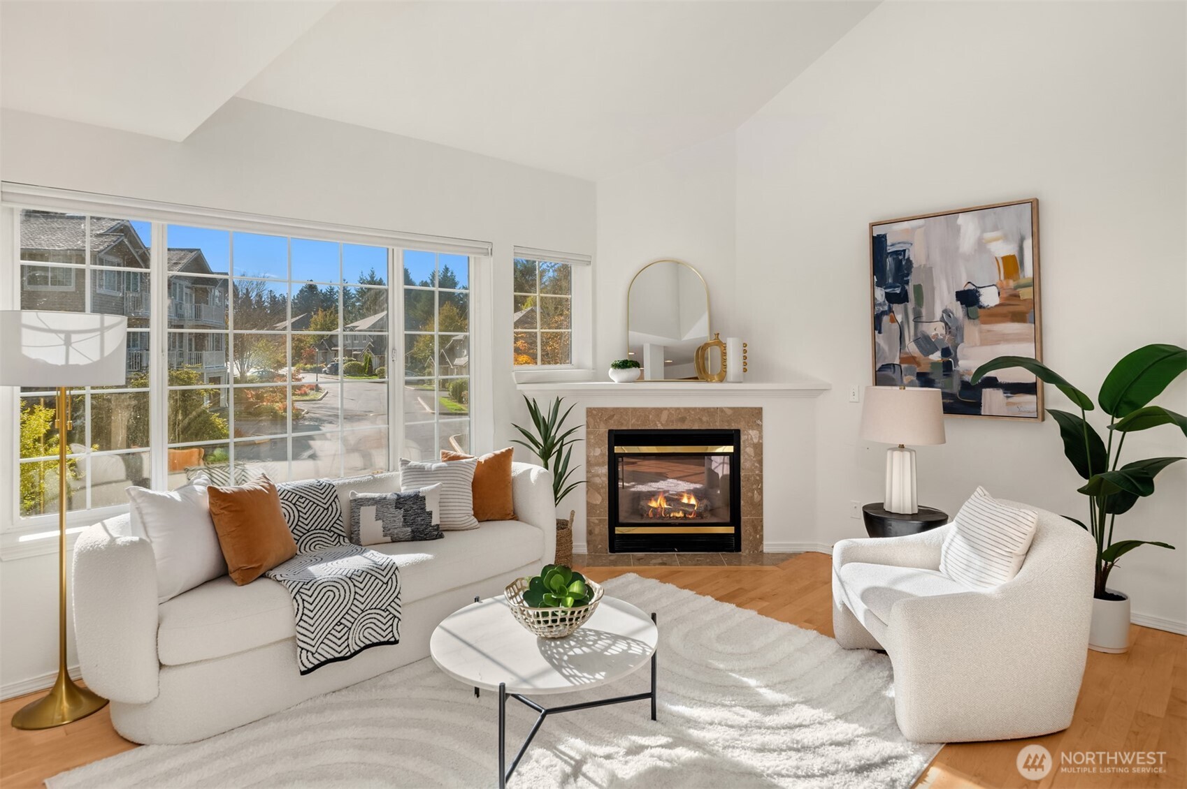 You’ll love the sunlight pouring through large windows, the open floor plan, double volume ceiling, and hardwood floor throughout!