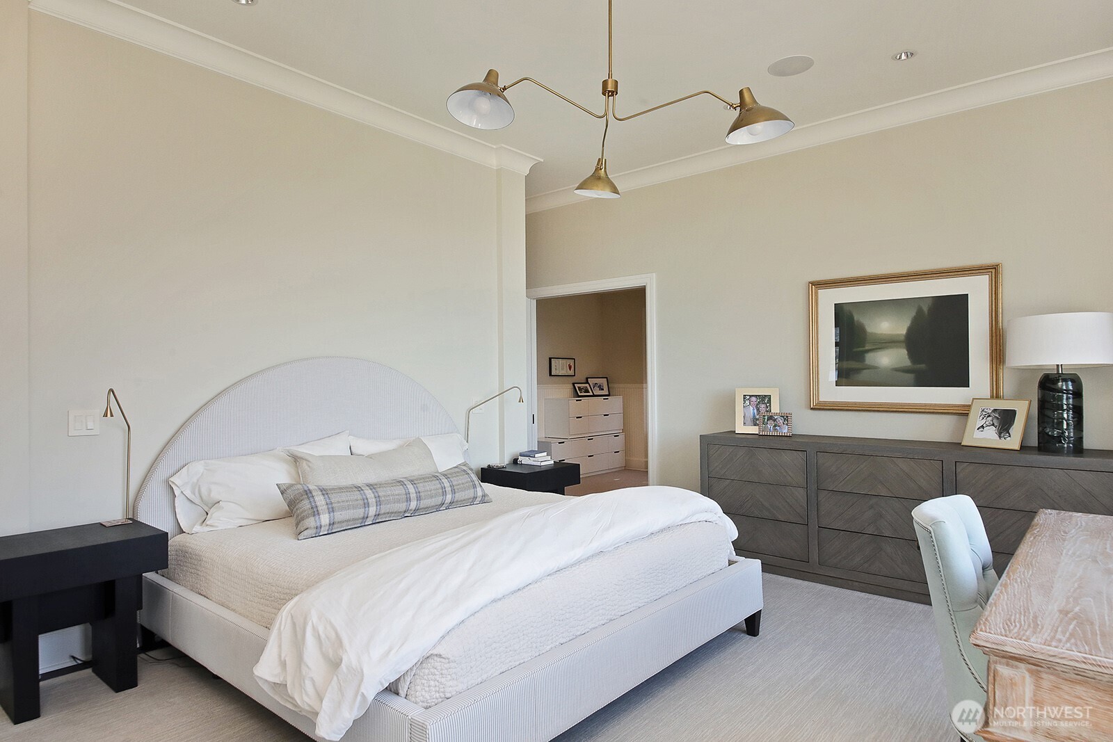 The primary suite includes a sitting room, dressing room, dual walk-in closets, private balcony, and sumptuous en-suite bath.