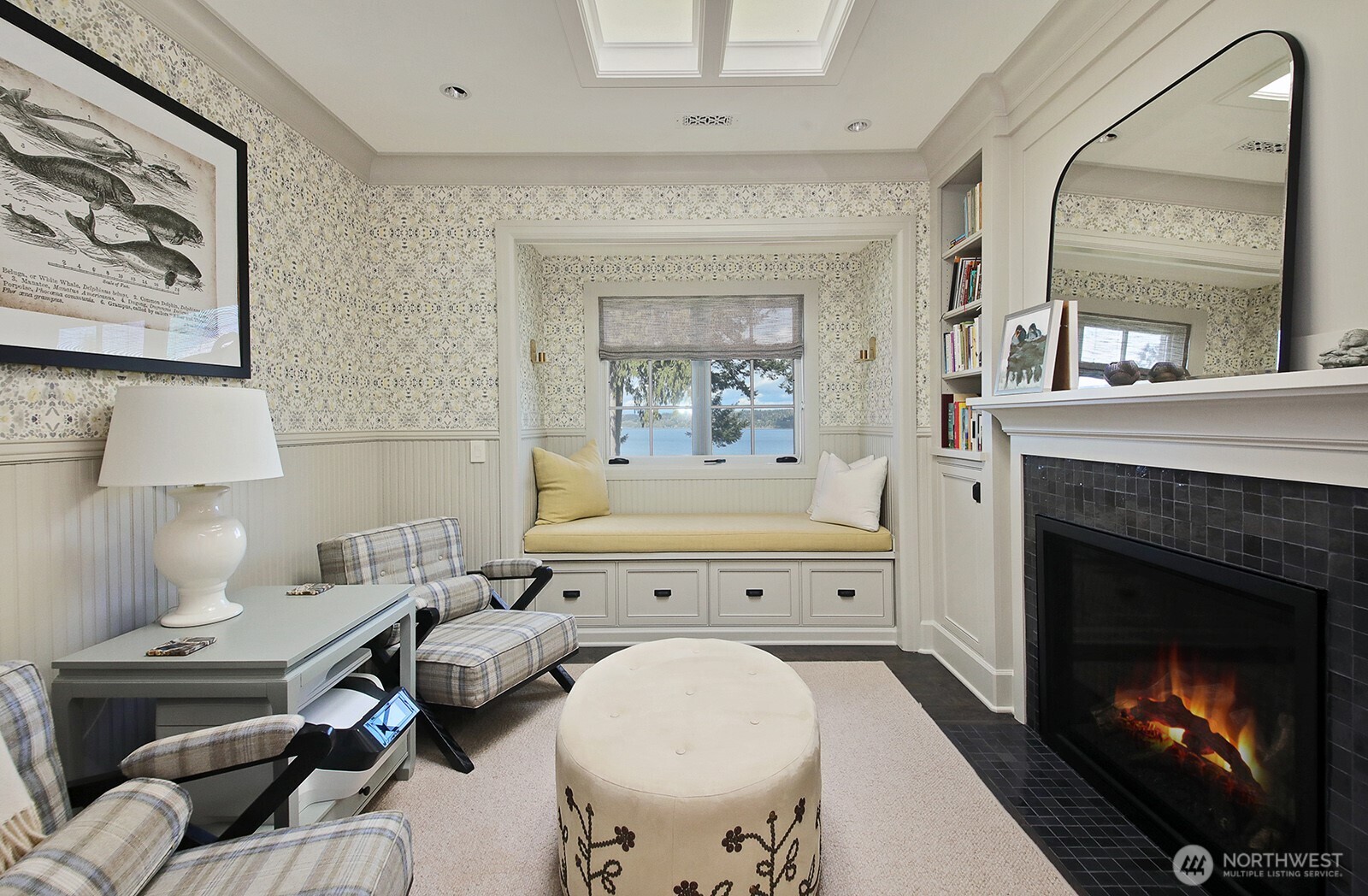 Such a charming, cozy room to end the day in the primary suite.