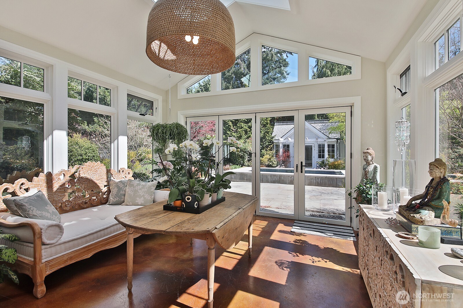 Beautiful sunroom, surrounded by the courtyard gardens.