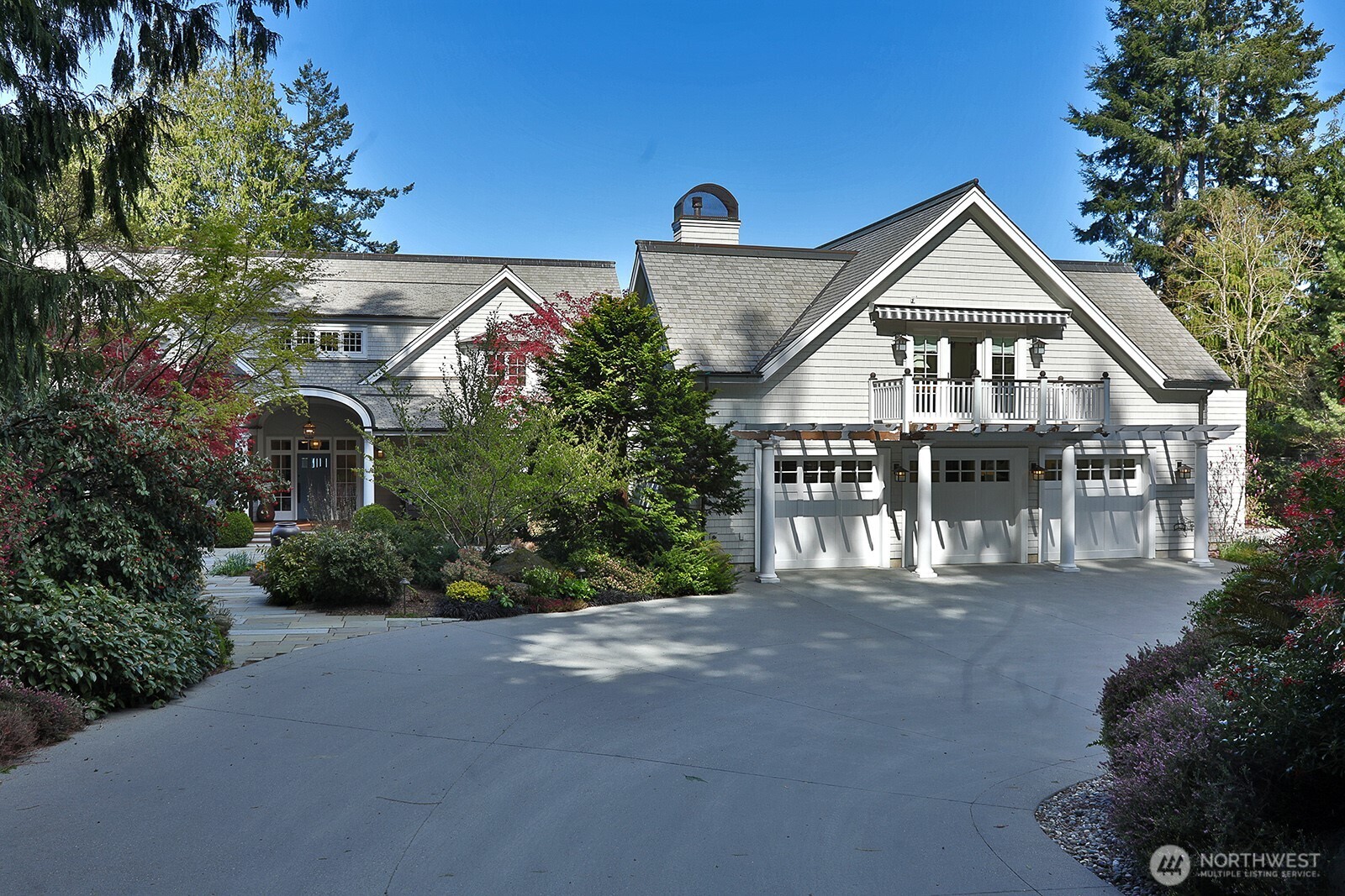 Three-car garage with space upstairs that can be used as an office or for guest overflow.