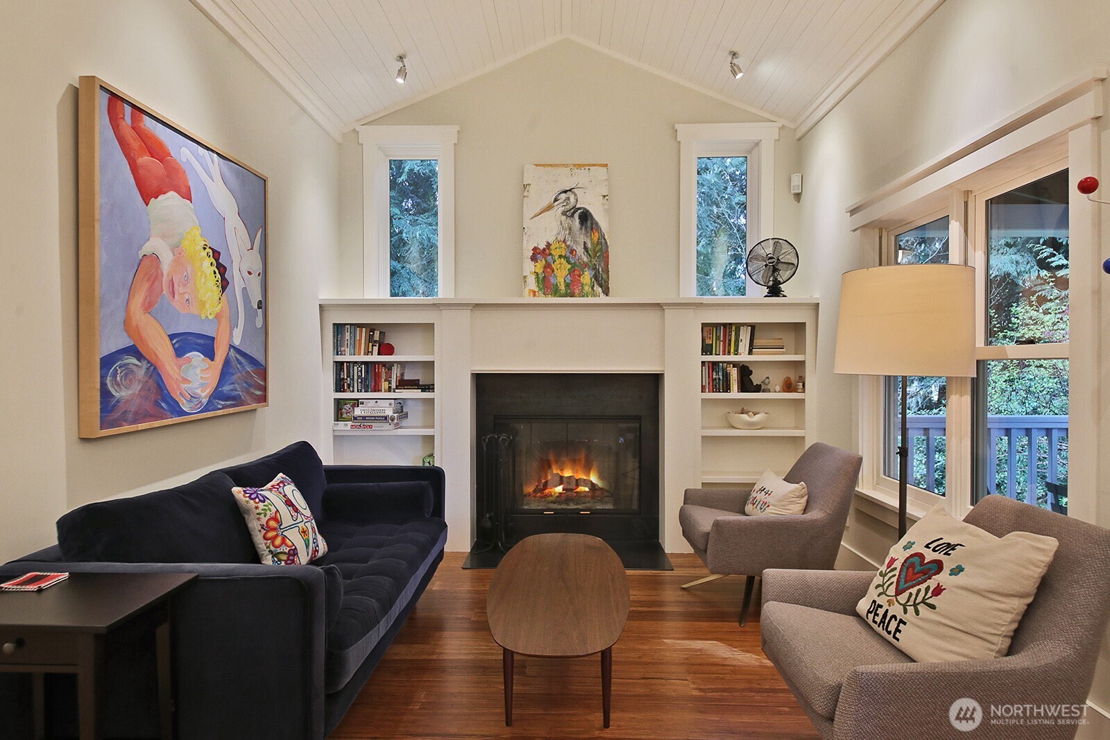 The living room in the guest cottage with vaulted ceilings and fireplace. So cozy!