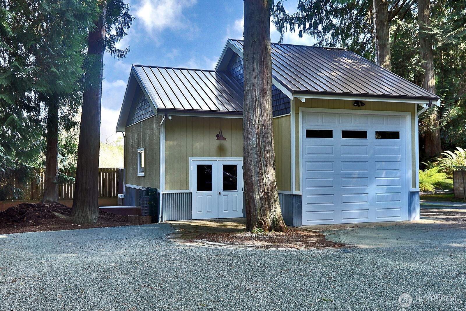 Secondary garage with oversized door and workshop.