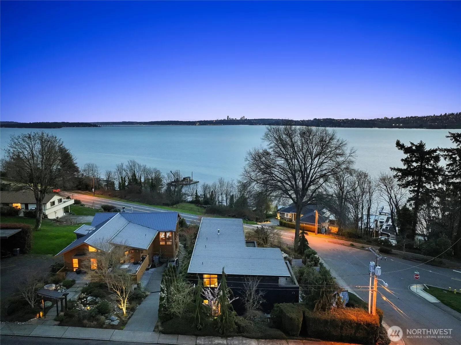 Sweeping westerly views of Lake Washington, the Seattle skyline, and breathtaking sunsets, all within the coveted West of Market neighborhood