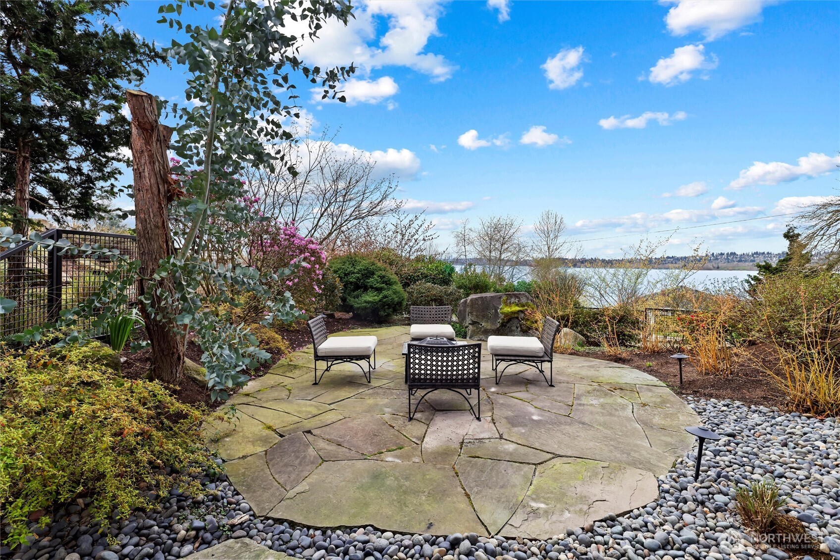 Beautiful patio with gas fire pit overlooking the lake